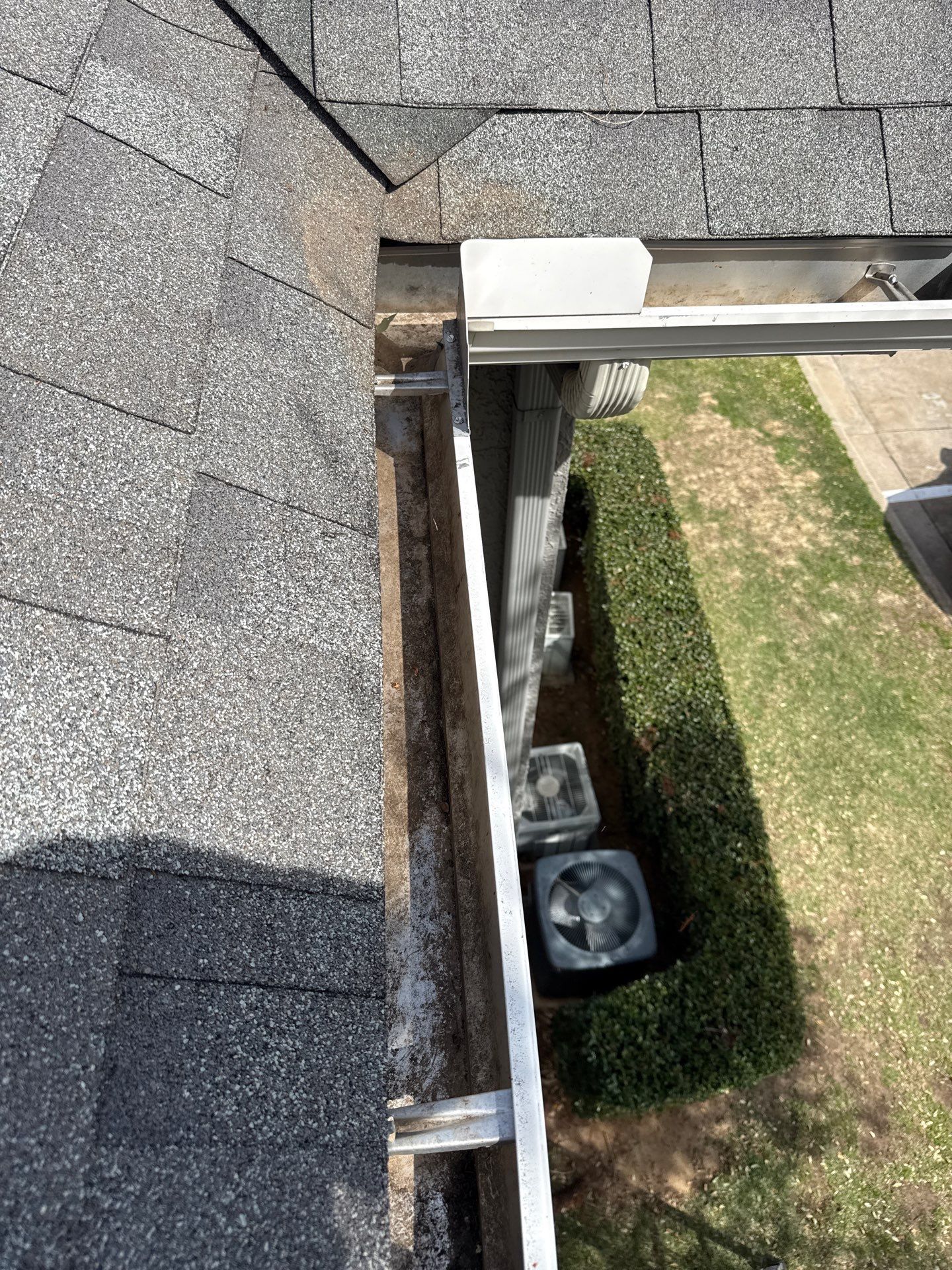HOA gutter cleaning in Flower Mound & Lewisville, after  photo showing full gutters.