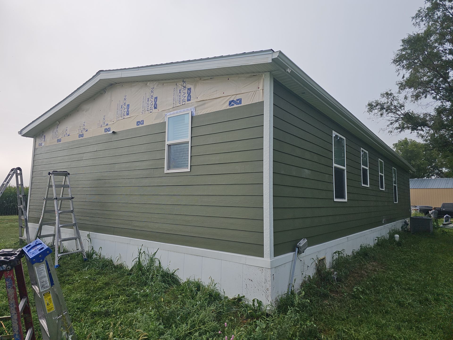 Riverdale Exterior Transformation | TAMKO Roofing & James Hardie Siding by Loyal Nine
