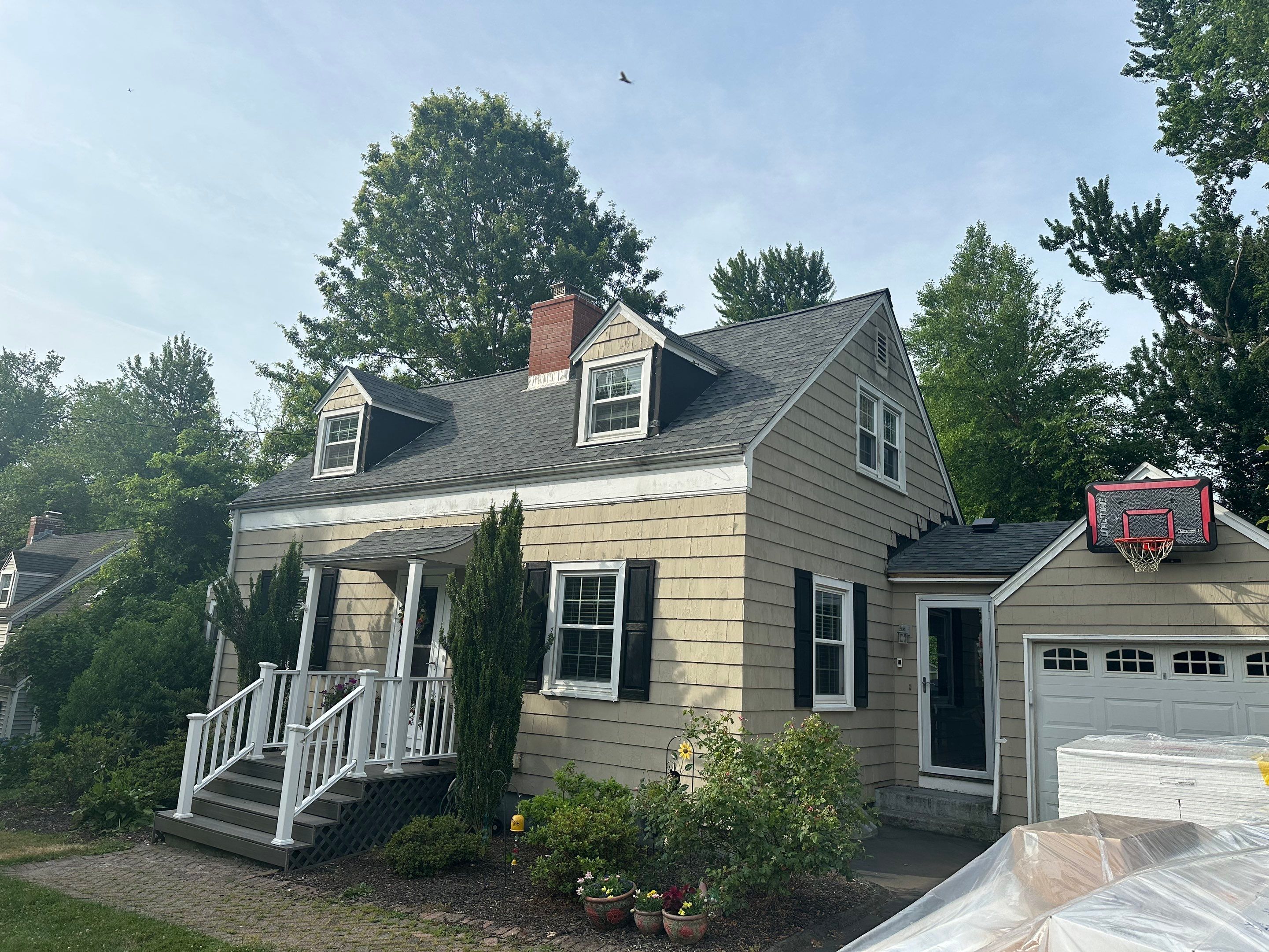 Complete Exterior Estate gray with Pacific Blue Siding by A Plus Exterior