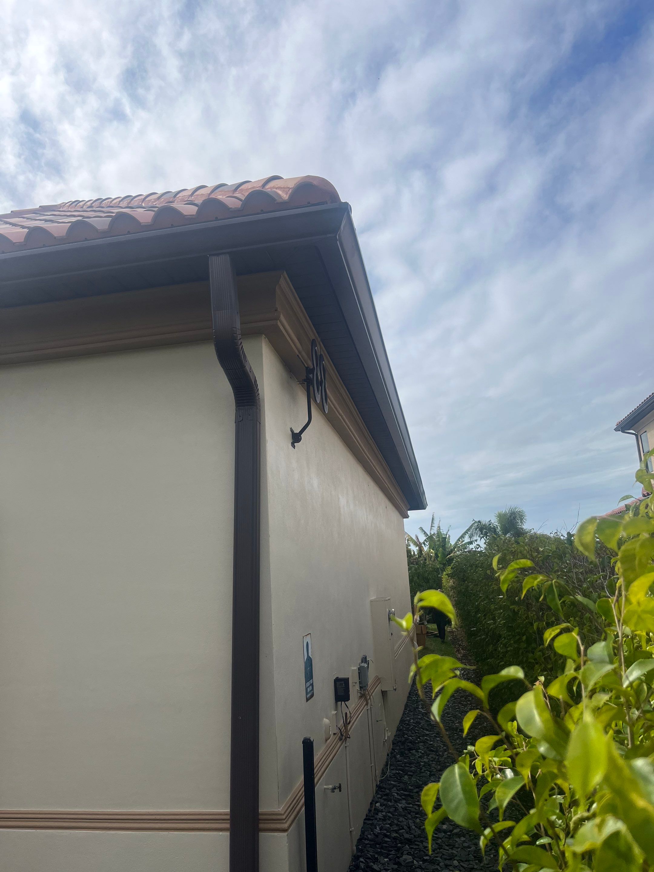 Musket Brown Seamless Gutters using Musket Brown Seamless Gutters in Cape Coral FL by Gutter Professors