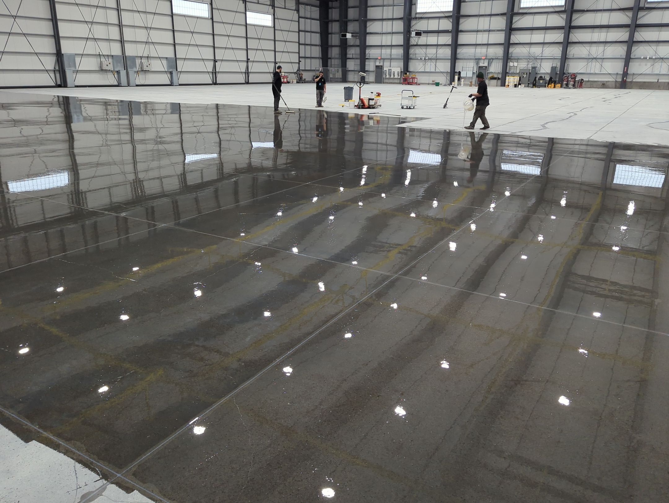 Airplane Hanger using Light Grey Commercial Penntek Epoxy by Croc Coatings, LLC
