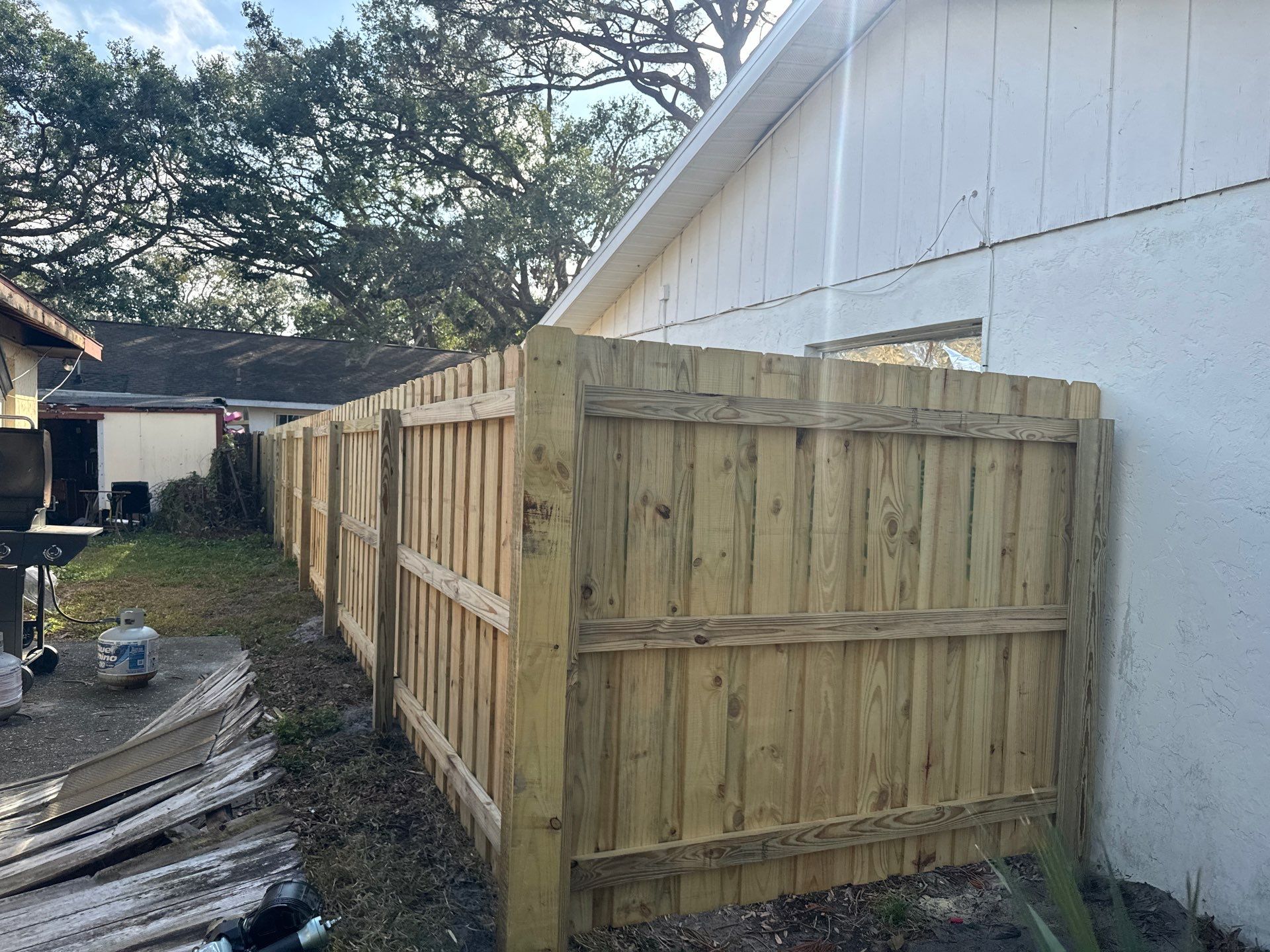 Wood Fence Installation using 6Ft Pressure Treated Wood Board On Board Privacy Fence by Asap fence and gates, LLC