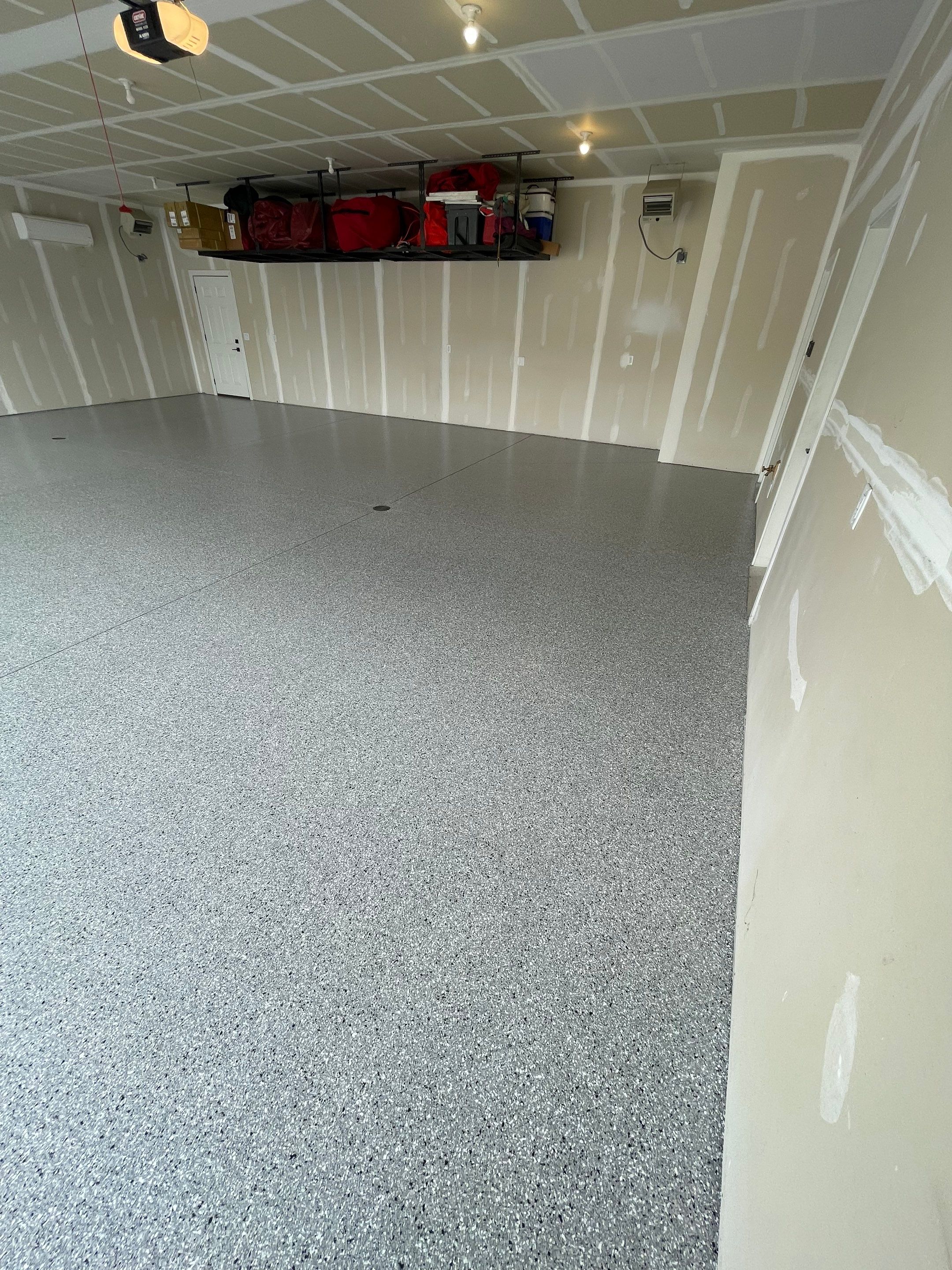 Grey Speckled Epoxy Floor Coating for Sioux Falls Garage by Select Painting, Coatings & Garage Cabinets