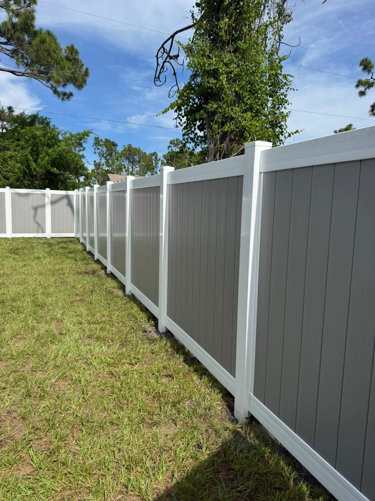 Two-Tone Vinyl Privacy Fence Installation in Port Charlotte by True Fence LLC