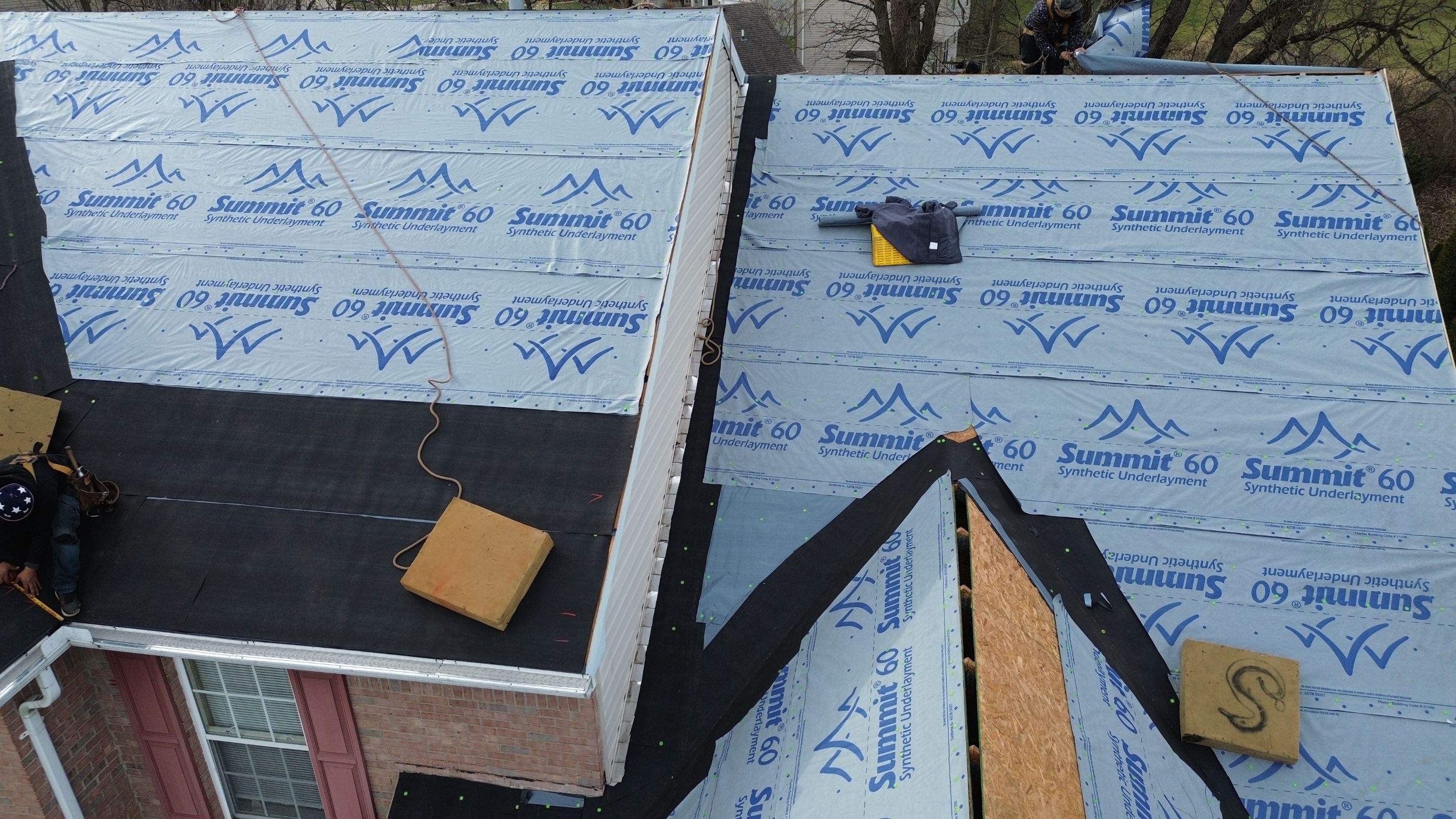 Walden Ponds - Pristine Black and Hydro Flo Gutter Guards by Tamlin Roofing