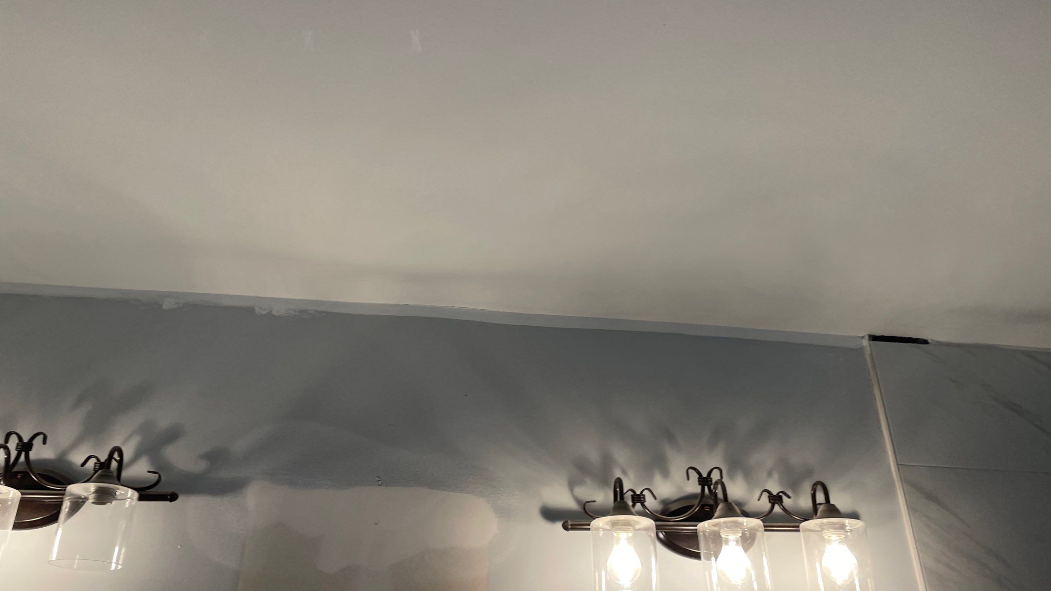 Bright Bathroom Remodel with Wall Removal, Stand Alone Tub and New Vanity by Footprints Floors of Coastal Carolina