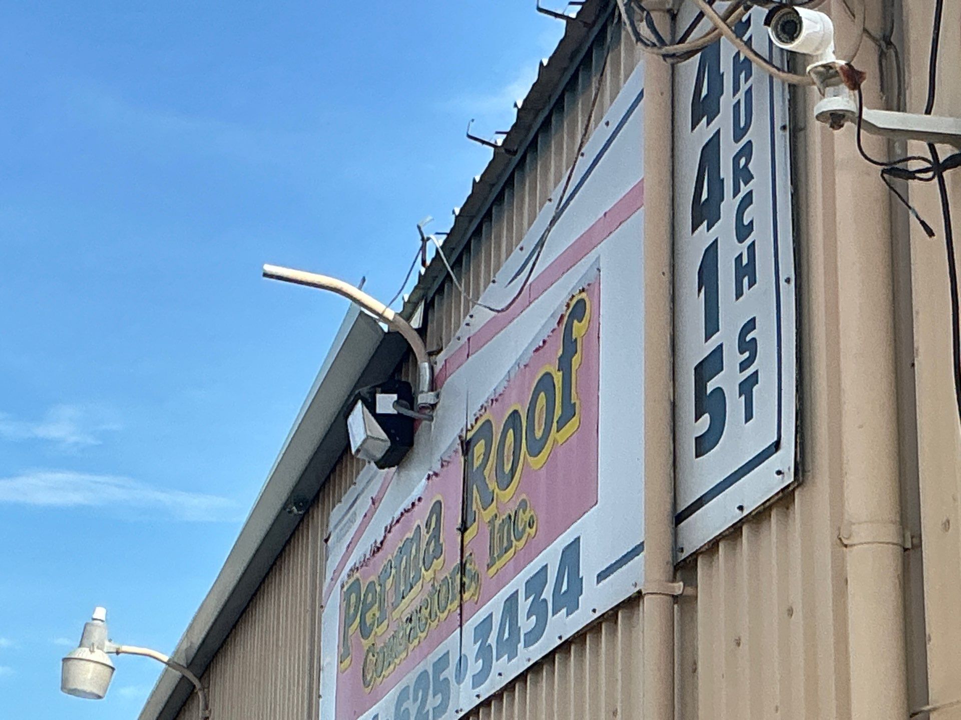 Black Aluminum Gutters with Matching Downspouts in Port Charlotte, FL by Gutter Professors