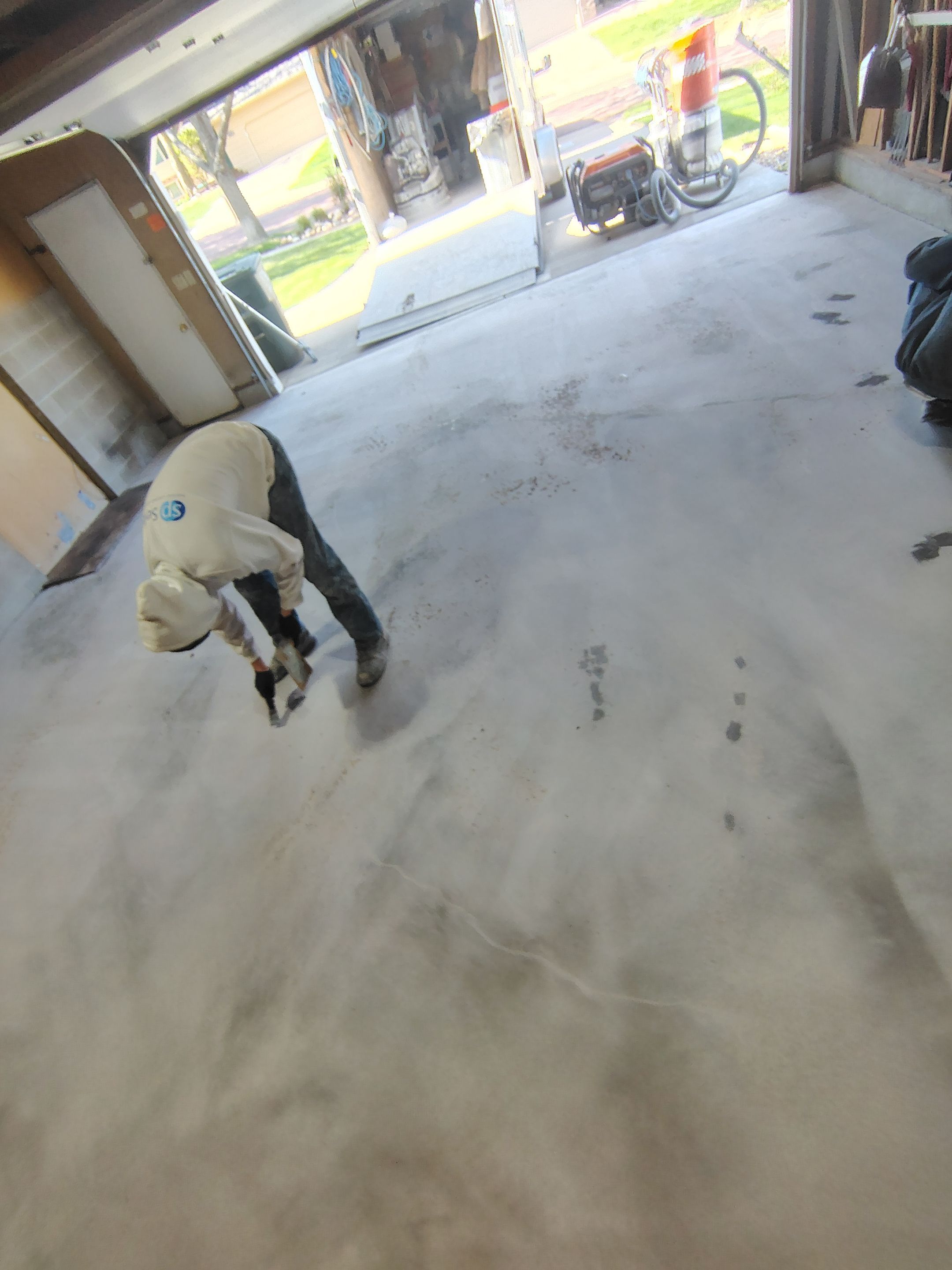 Sioux Falls Garage Epoxy Floor Installation and Concrete Crack Repair by Select Painting, Coatings & Garage Cabinets