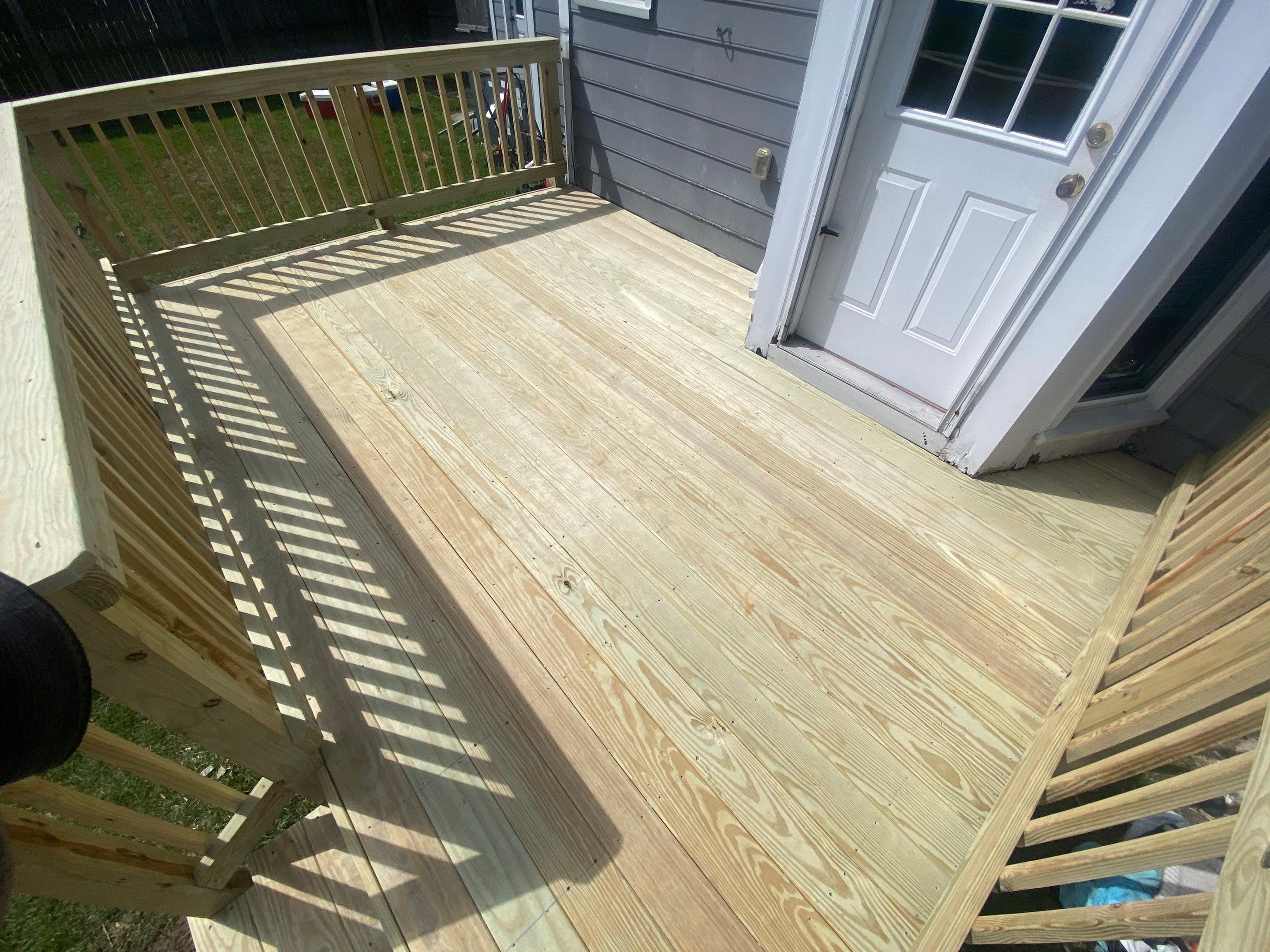 Pressure-Treated Wood Deck Resurface and Trim Repair in Fayetteville by The Remodeling Company