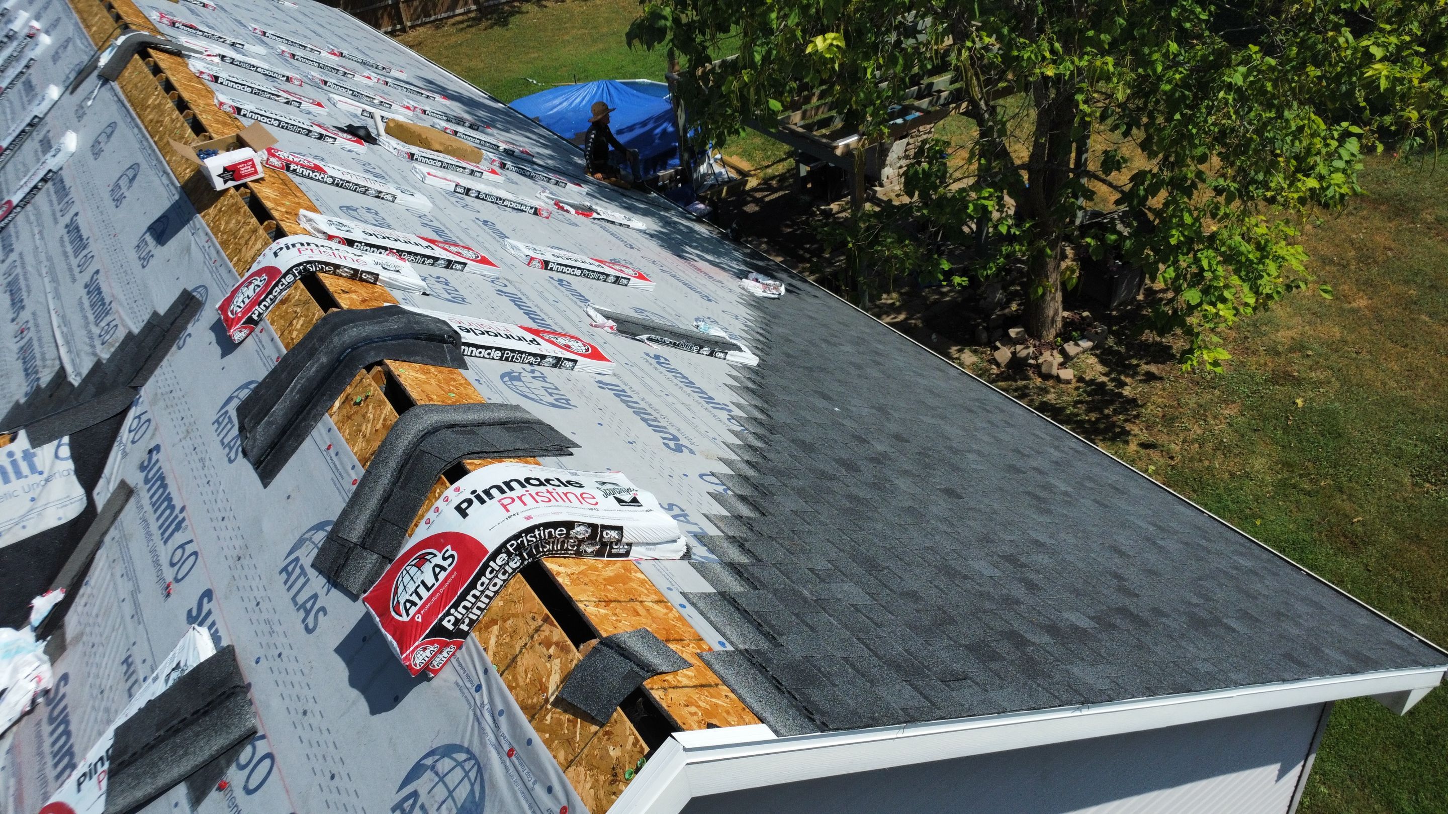 Residential Roof + Gutter & Downspouts & Gutter Guards Install  by Titan Commercial & Residential Roofing 