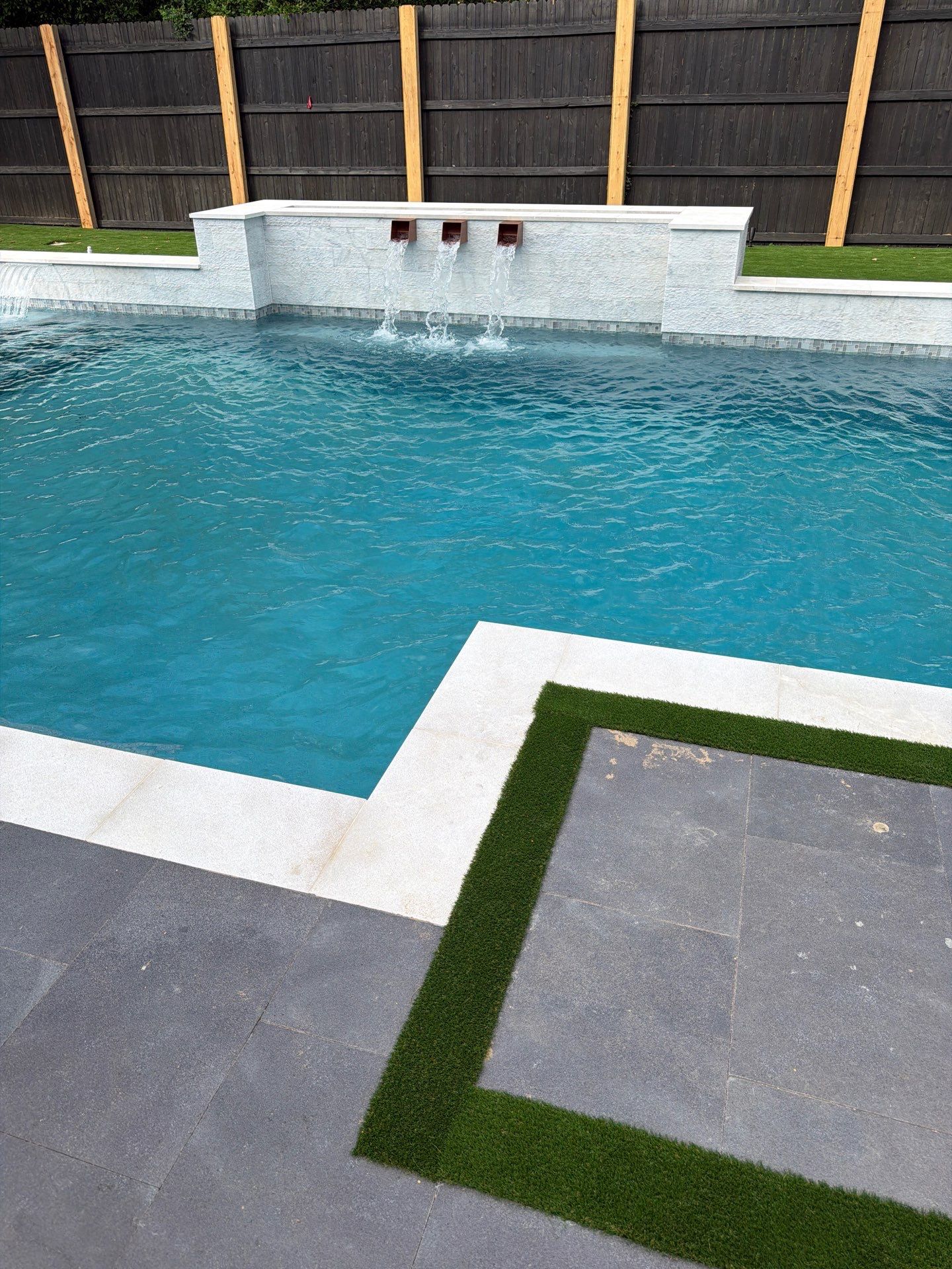 Modern Geometric Pool with Raised Spa and Sheer Descents by Pinnacle Pools and Spas - DFW