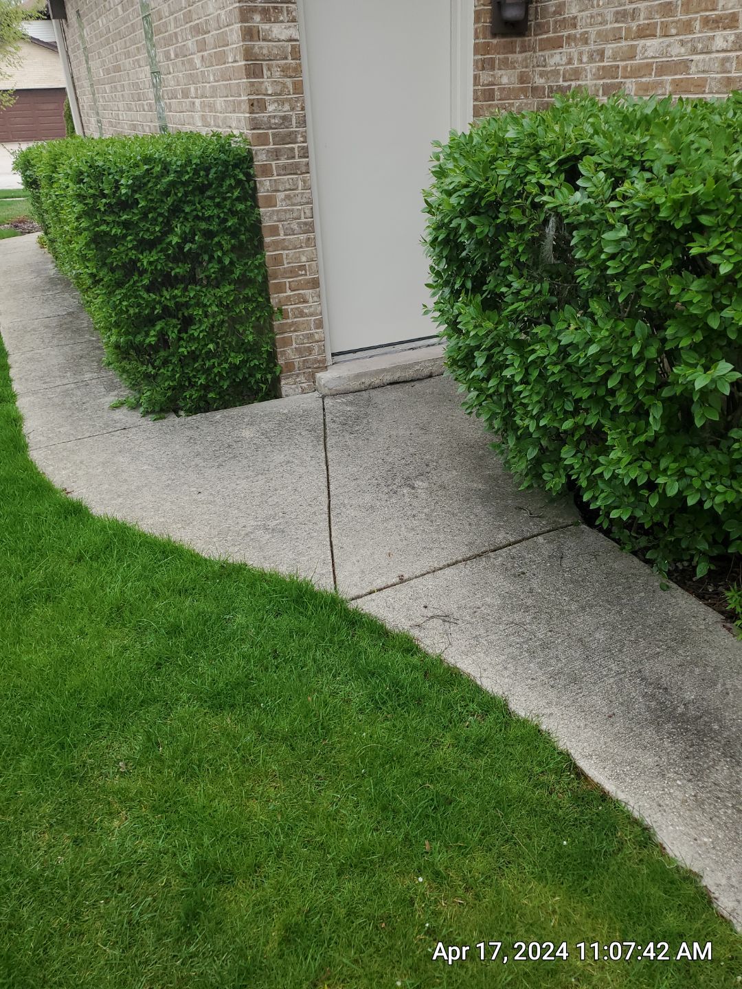concrete patio and driveway cleaning by Northern Power Washing LLC.