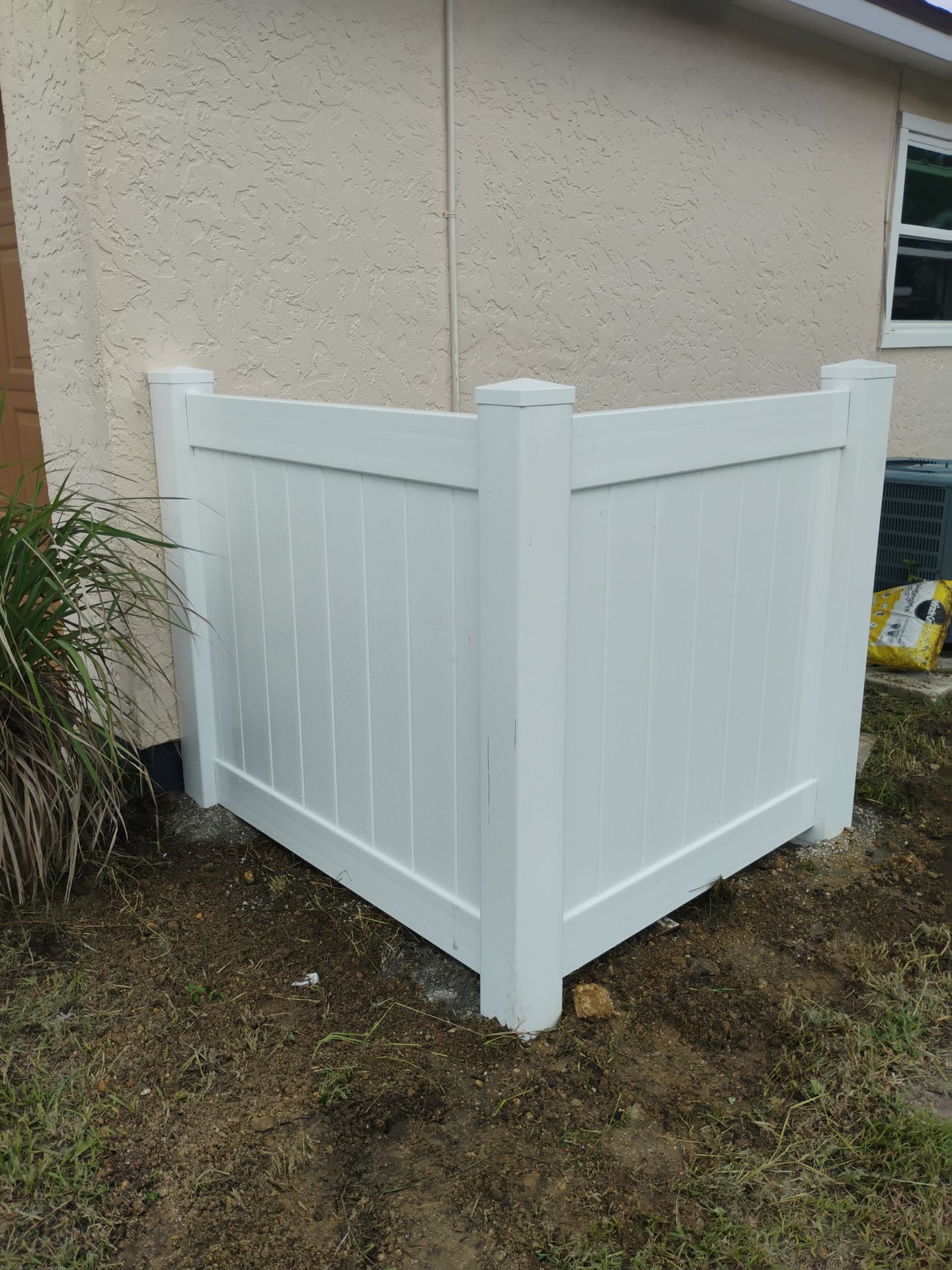 White Vinyl Privacy Fence and HVAC Enclosure in Port Charlotte by True Fence LLC