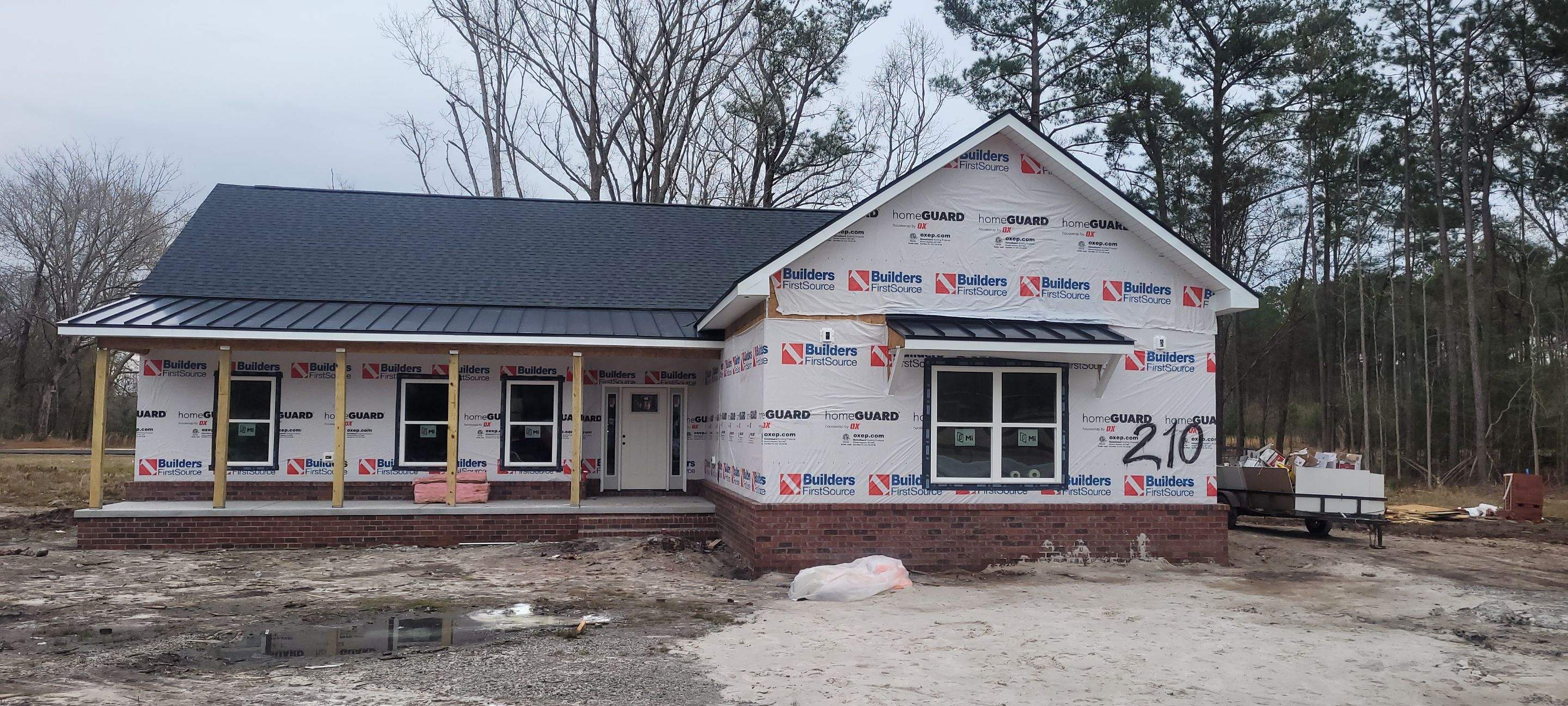 New Home Construction using brick and vertical vinyl by Cornerstone Home Builders, LLC
