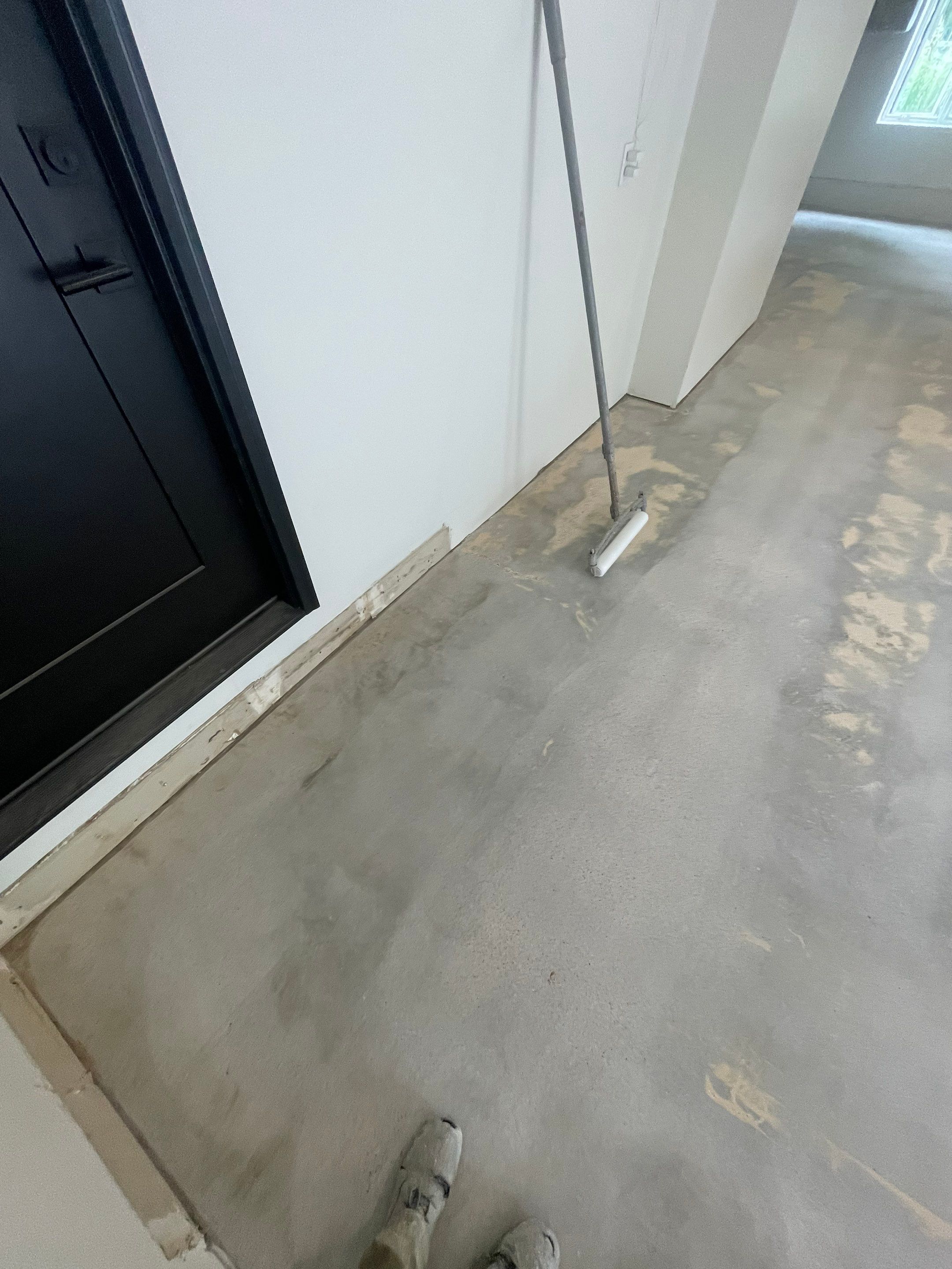 Gray Speckled Epoxy Garage Floor Coating in Sioux Falls by Select Painting, Coatings & Garage Cabinets