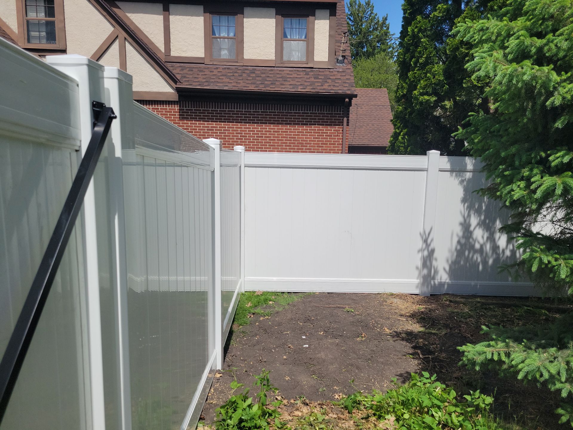 Residential White Vinyl Privacy Fence Installation in Waterloo by Perfect Picket Fence and Stain