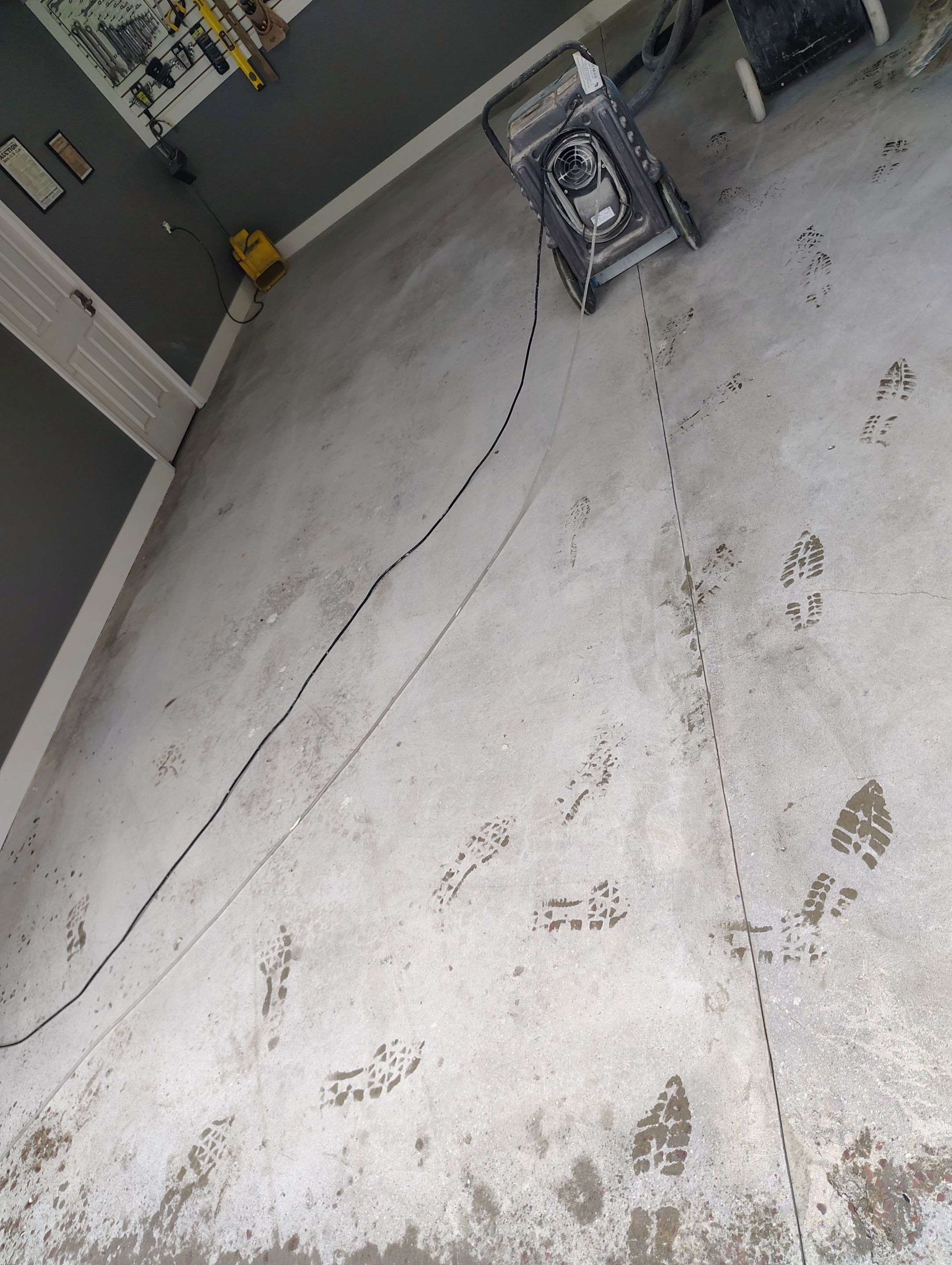 Custom Garage Floor Coating and Backyard Patio Refinishing in Tyndall by Select Painting, Coatings & Garage Cabinets
