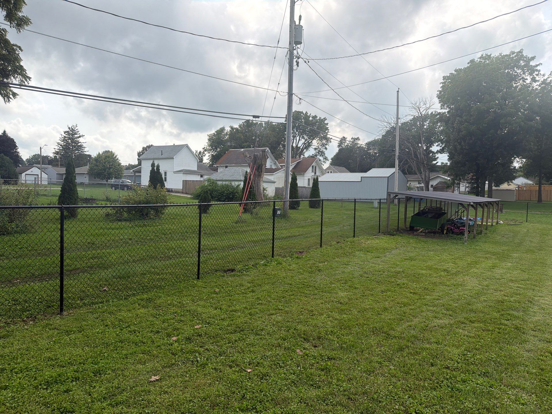 Residential Black Chain Link Fence Installation in Reinbeck by Perfect Picket Fence and Stain