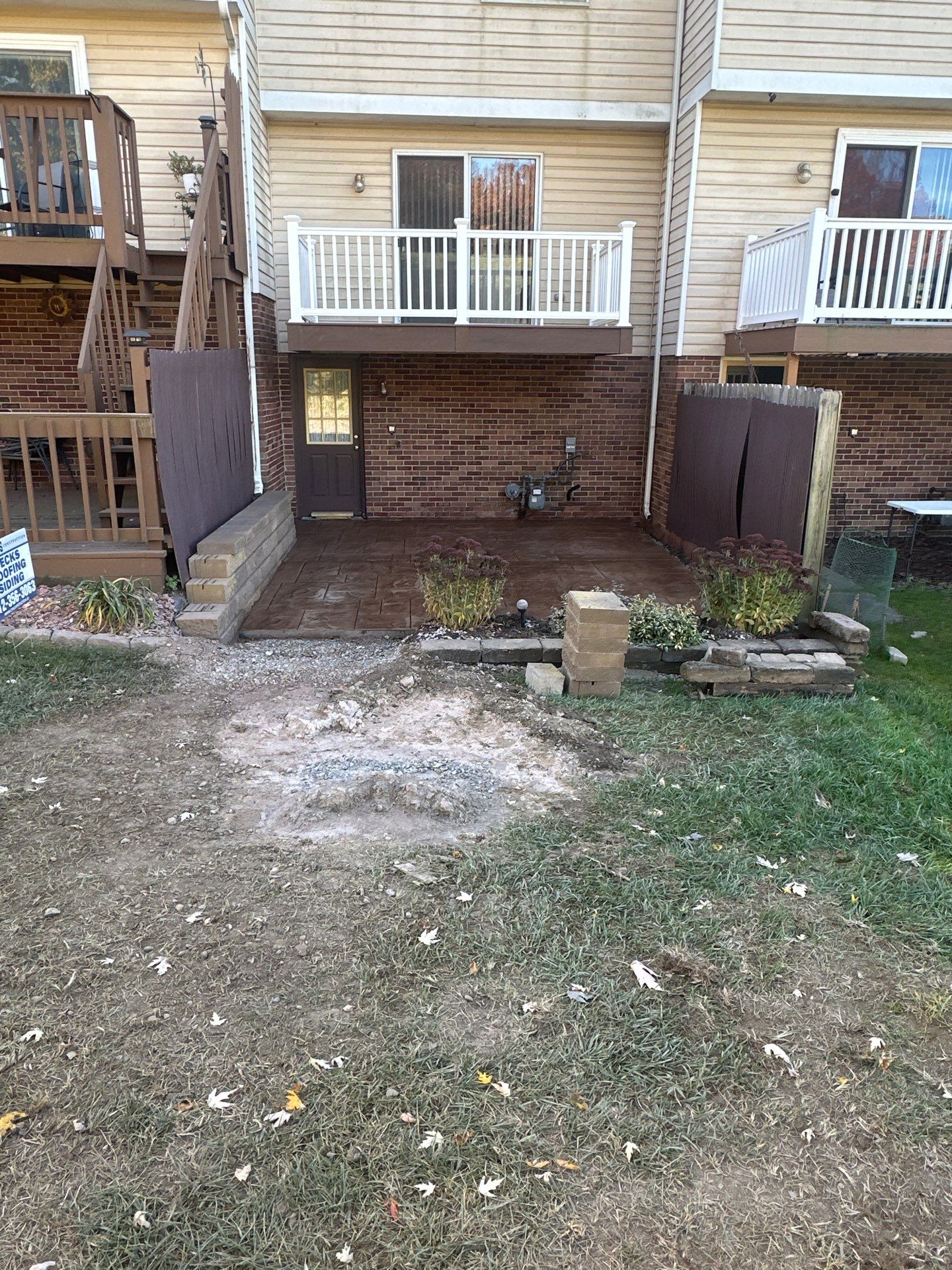 Stamped concrete and redeck  by Cousins Roofing Siding & Decks