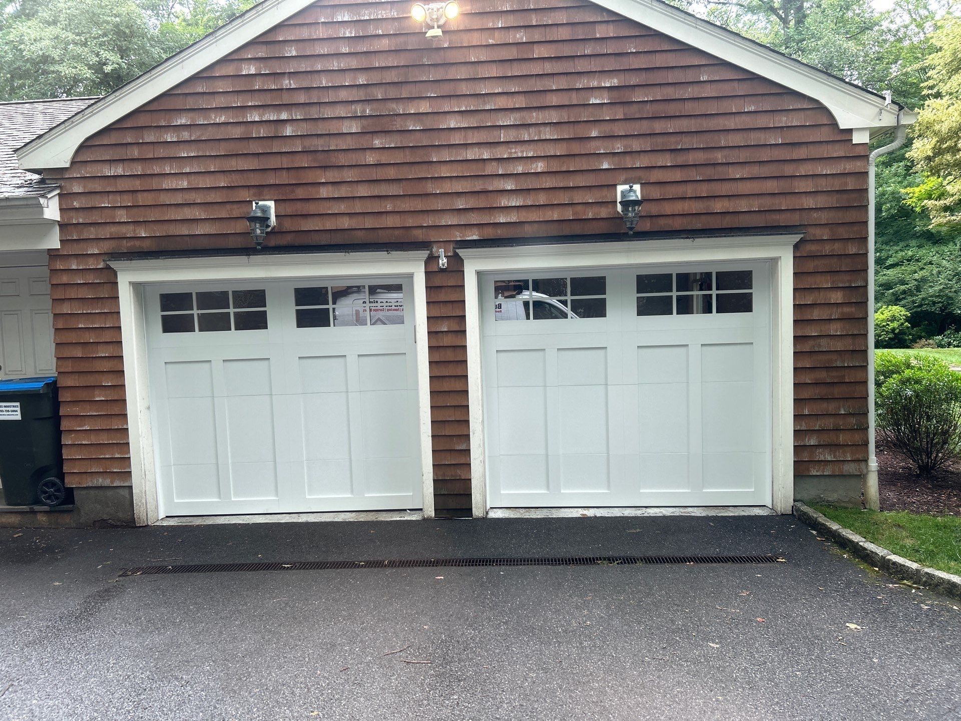 Classic Curb Appeal with an Amarr Carriage Court Garage Door by DiGiorgi Roofing and Siding Inc