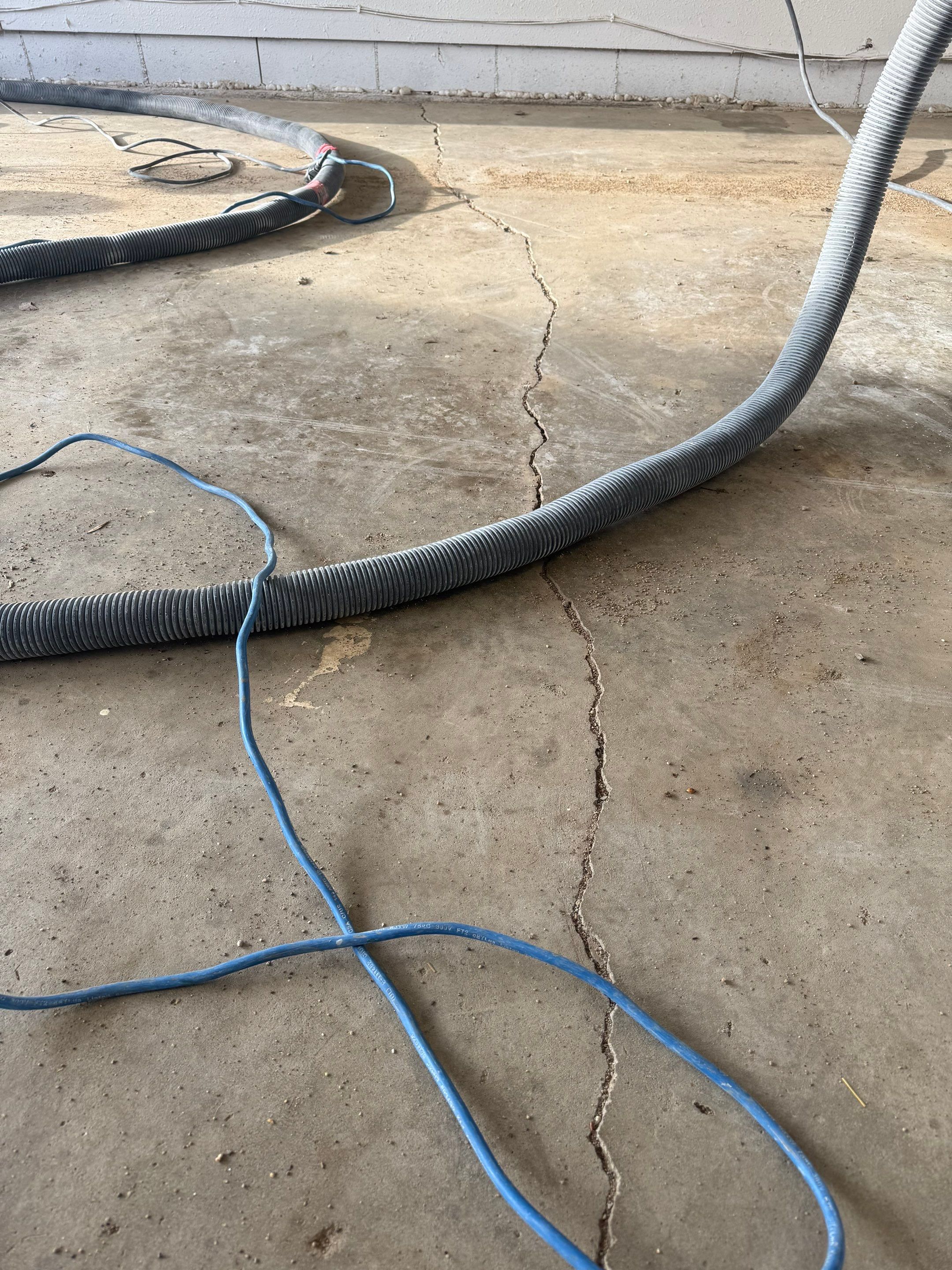 Feather Grey Garage Floor Coating and Crack Repair in Beresford by Select Painting, Coatings & Garage Cabinets