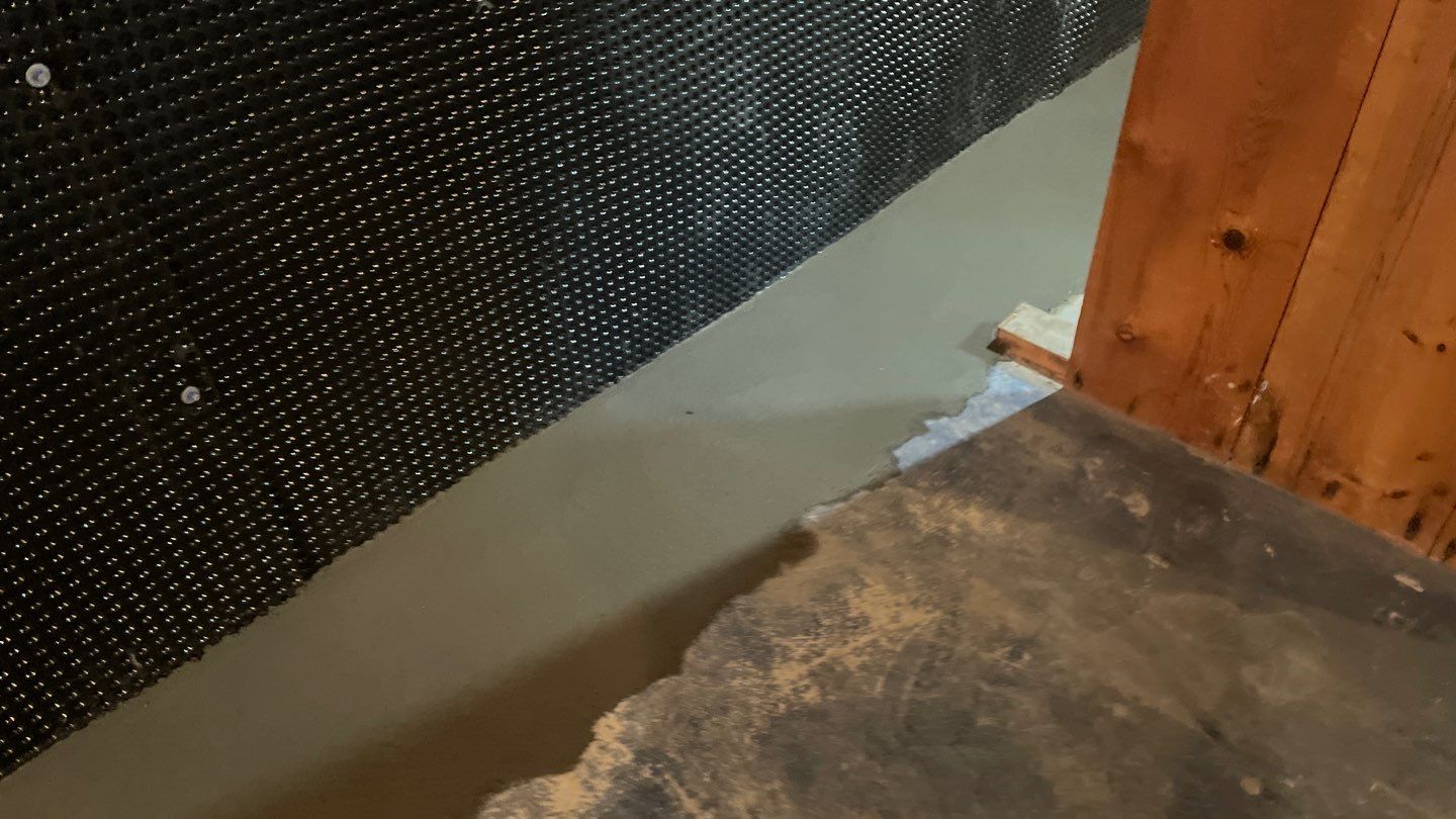 Interior Drain Tile & Buried Discharge in South Minneapolis by Waterproofing Northeast