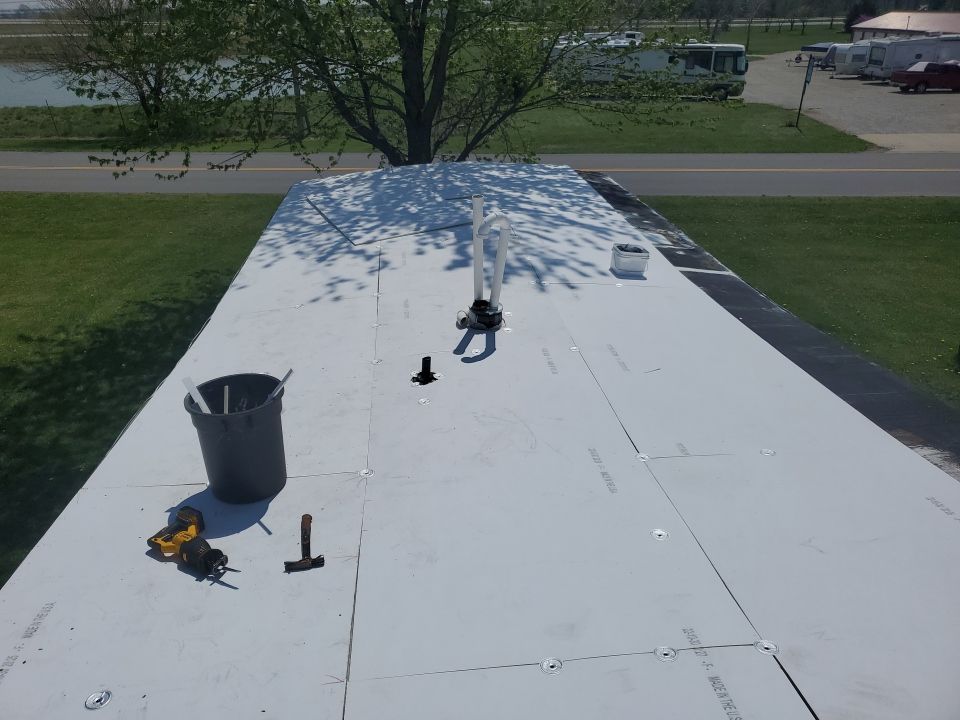 Residential Roofing Installation using 60 mil rubber roof  by Nitro Roofing and Construction