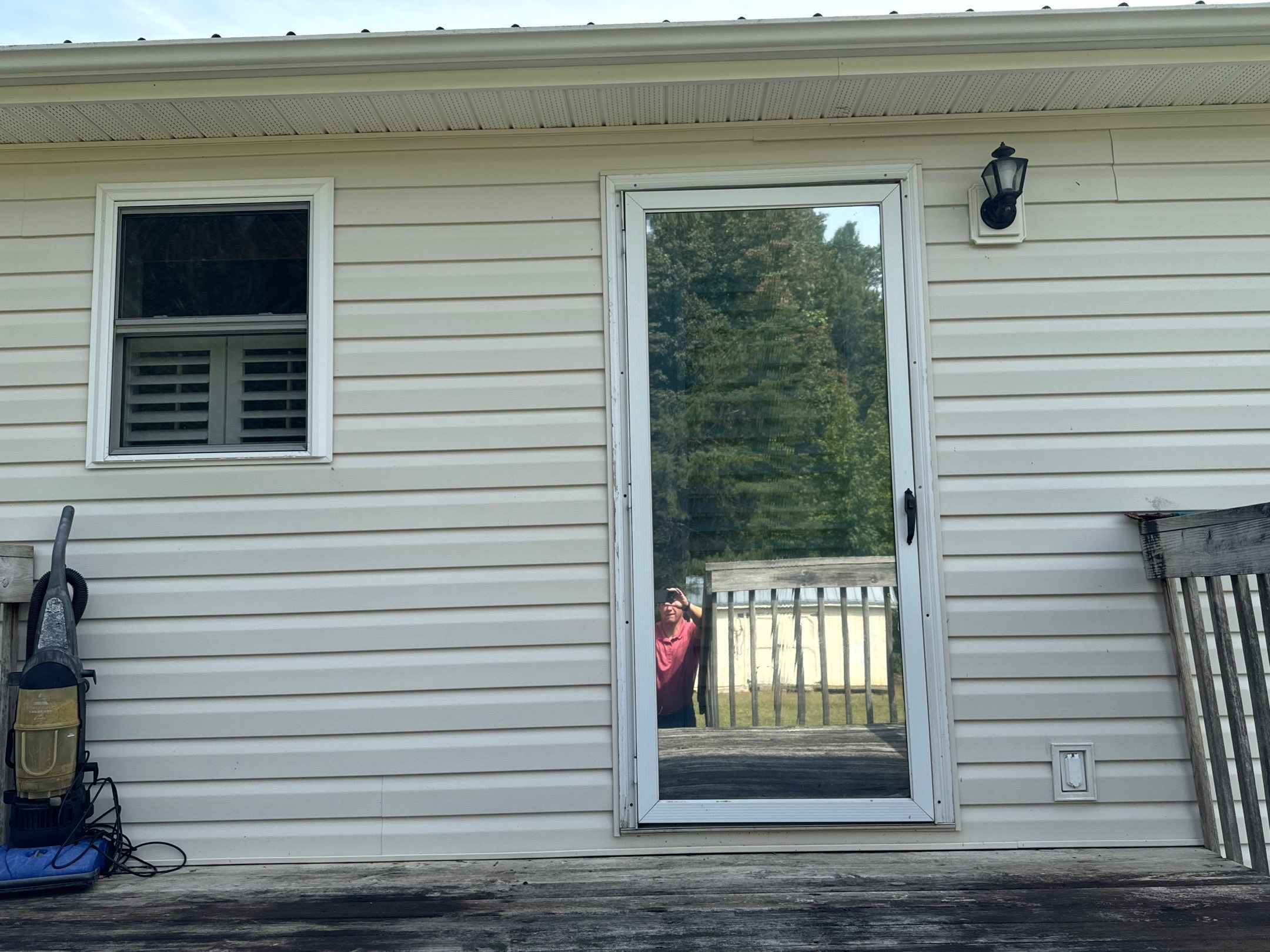 the service is cleaning the house siding and surrounding surfaces to remove dirt and grime for a refreshed appearance