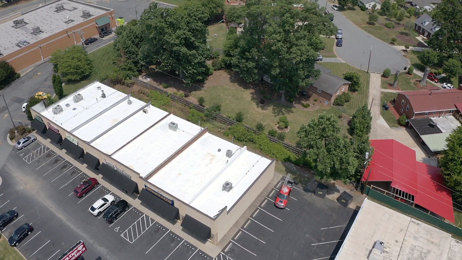 Commercial Roof Coating using Fiberseal basecoat and Silicon Topcoat by Just In Time Roofing and Restoration