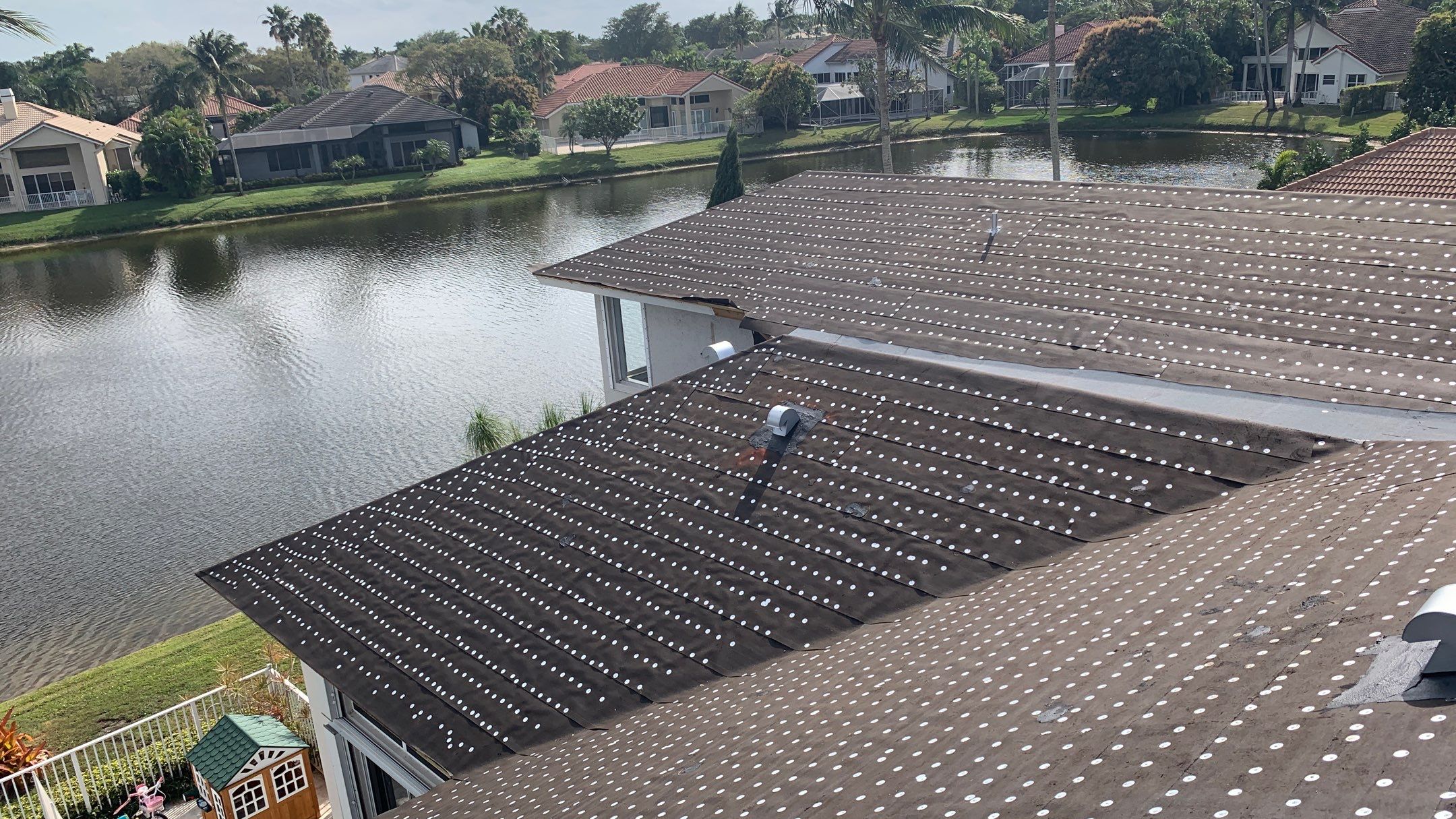 Residential Roofing Installation using 1" Nail strip metal roof by BLUES BROTHERS CONSTRUCTION CORP