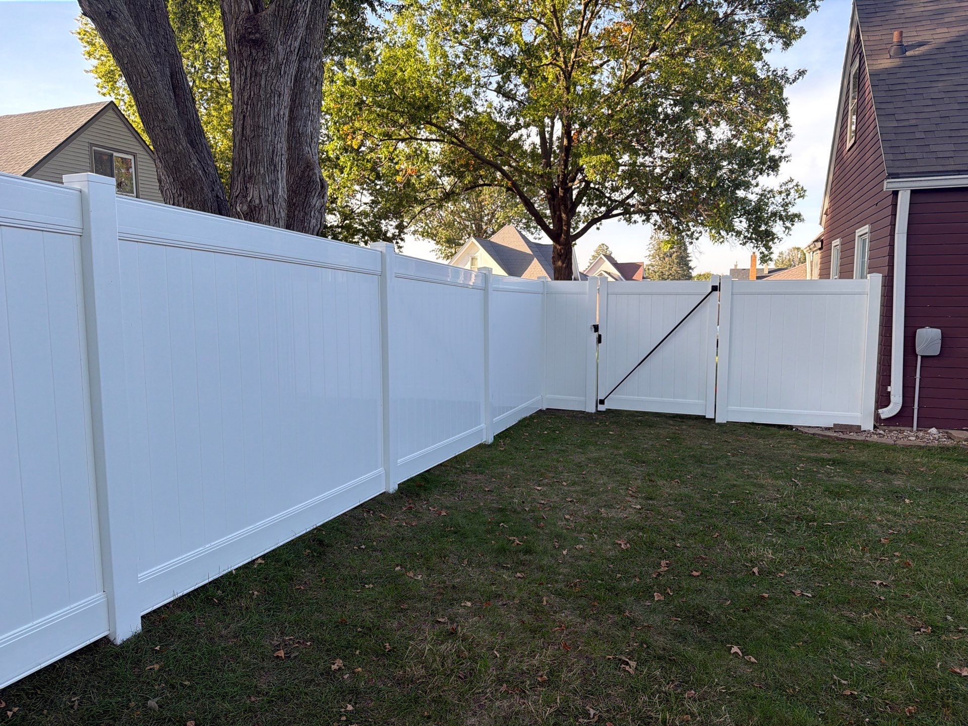 White Vinyl Privacy Fence and Gate Installation in Grundy Center by Perfect Picket Fence and Stain