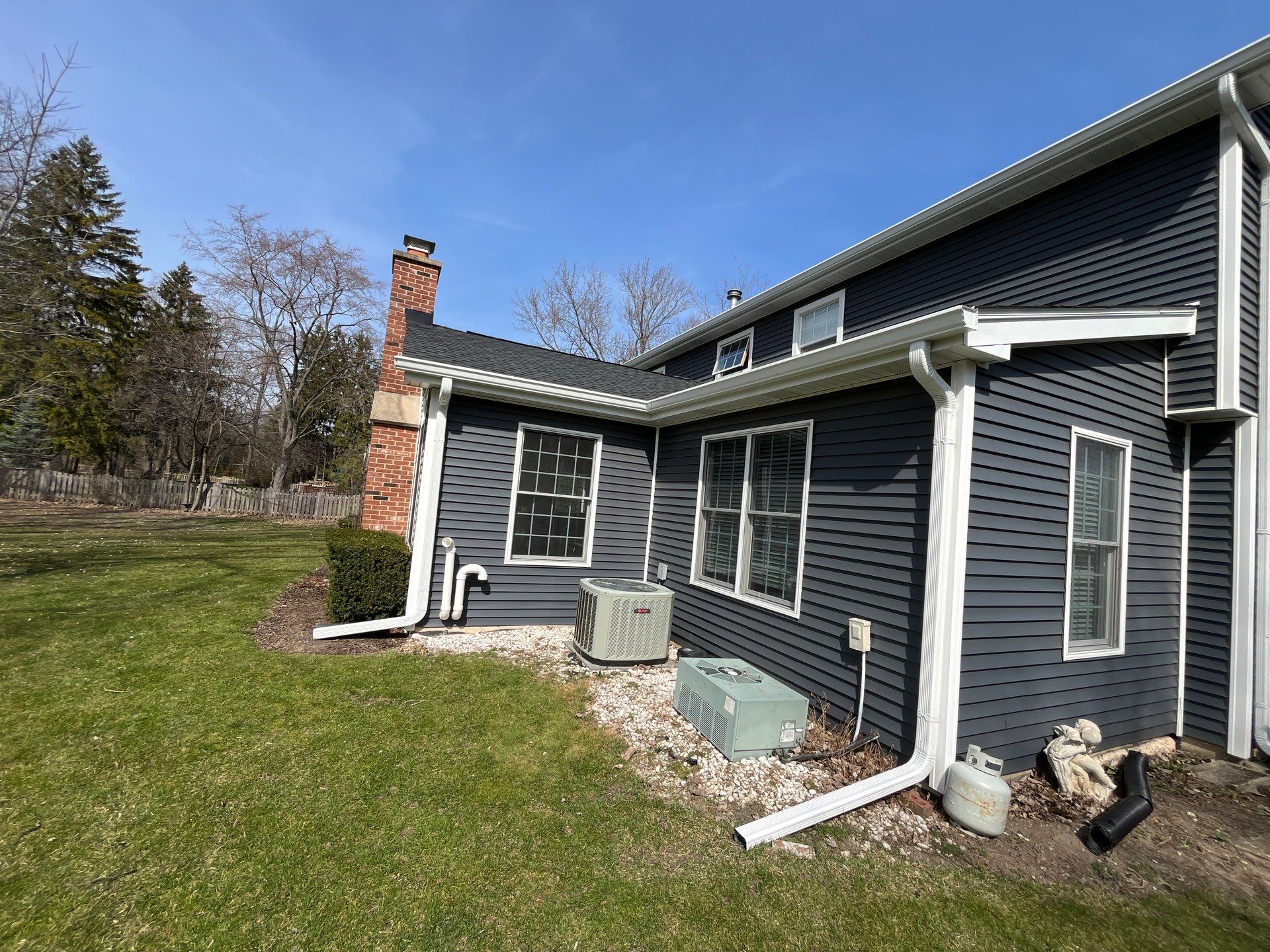 Asphalt Roof Replacement with Aluminum Gutter Installment by Custom Installations