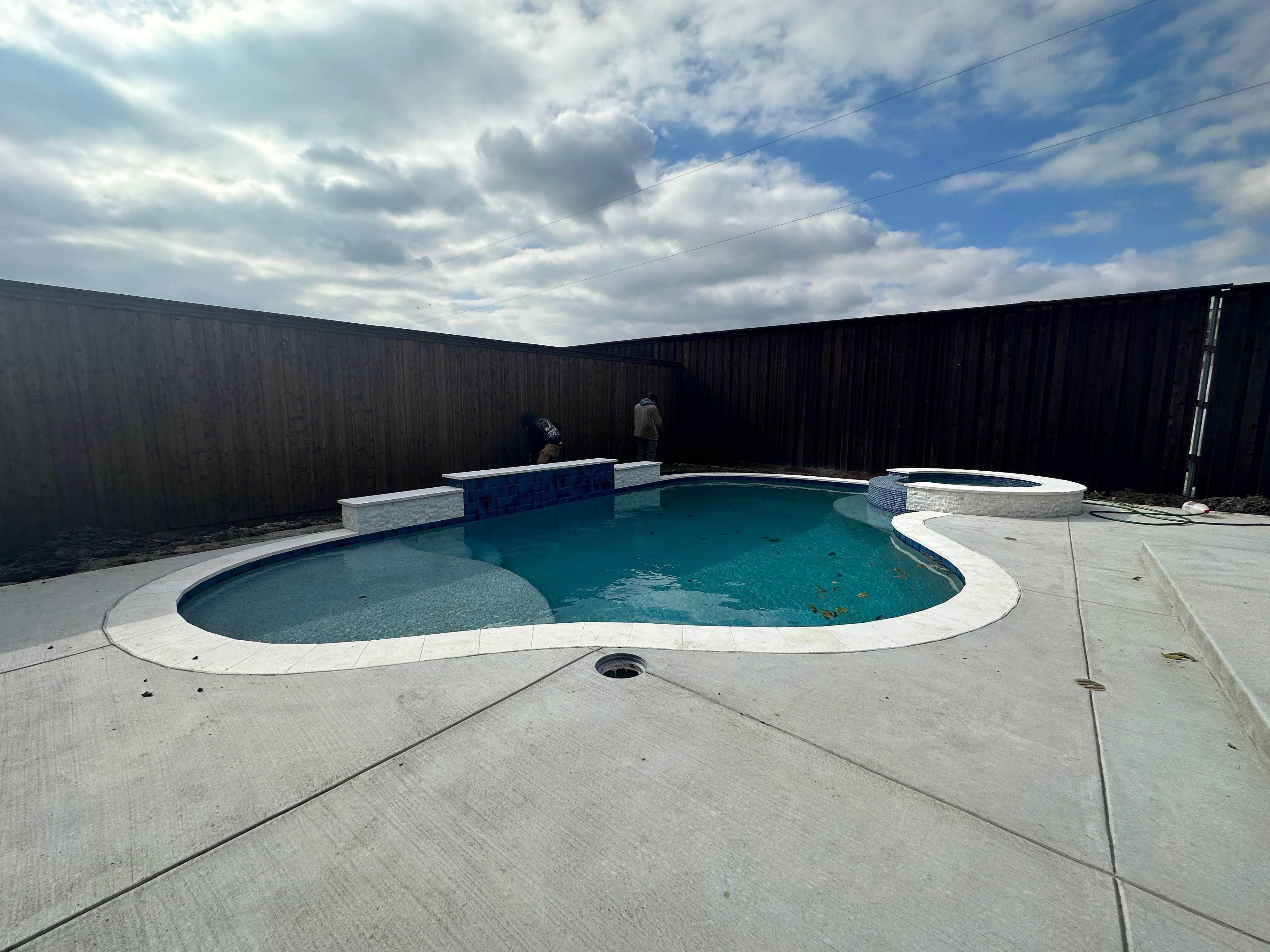 Freeform Pool with Rock Waterfall and Raised Spa by Pinnacle Pools and Spas - DFW