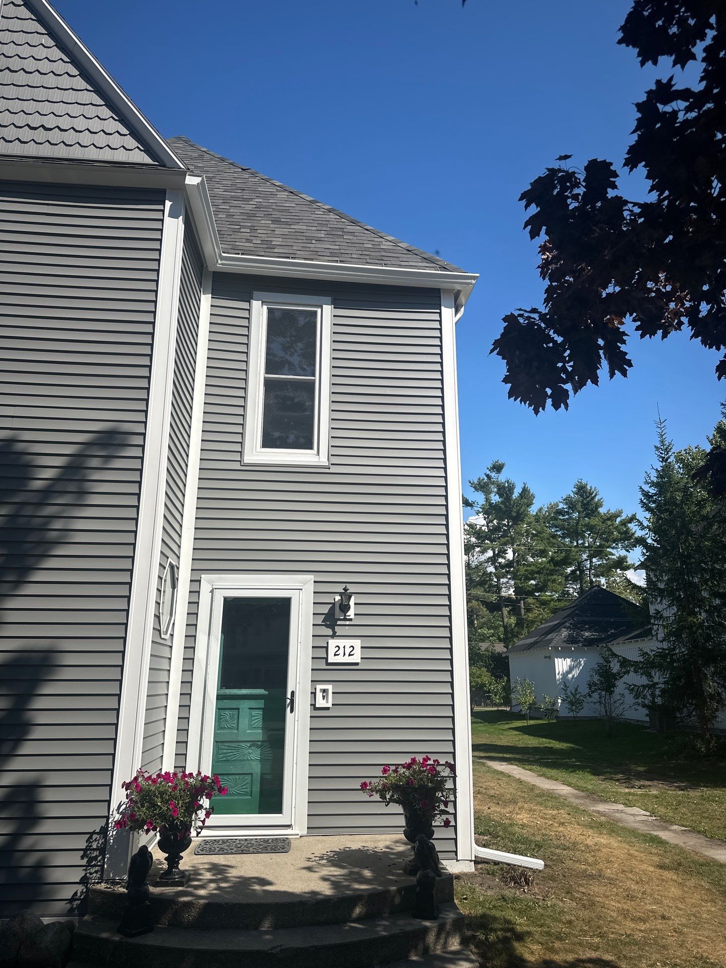 Complete Gutter and Downspout Installation in Charlevoix by Rainbow Seamless Systems