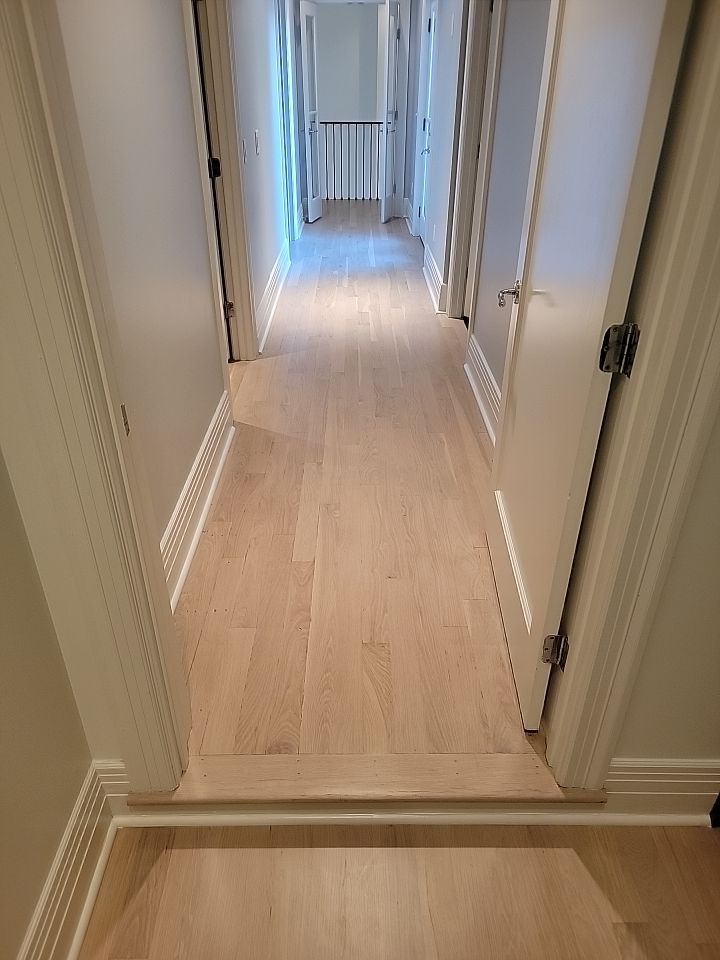 From dark to light, the results are stunning! Beautiful white oak refinish with Country White stain by Footprints Floors of Nashville