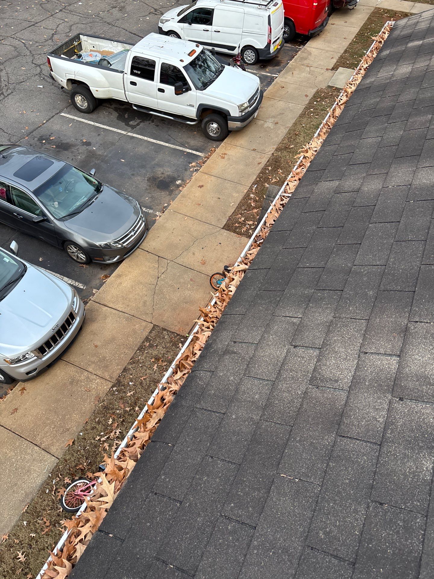 Commercial gutter cleaning Raleigh, NC before photo with filled gutters