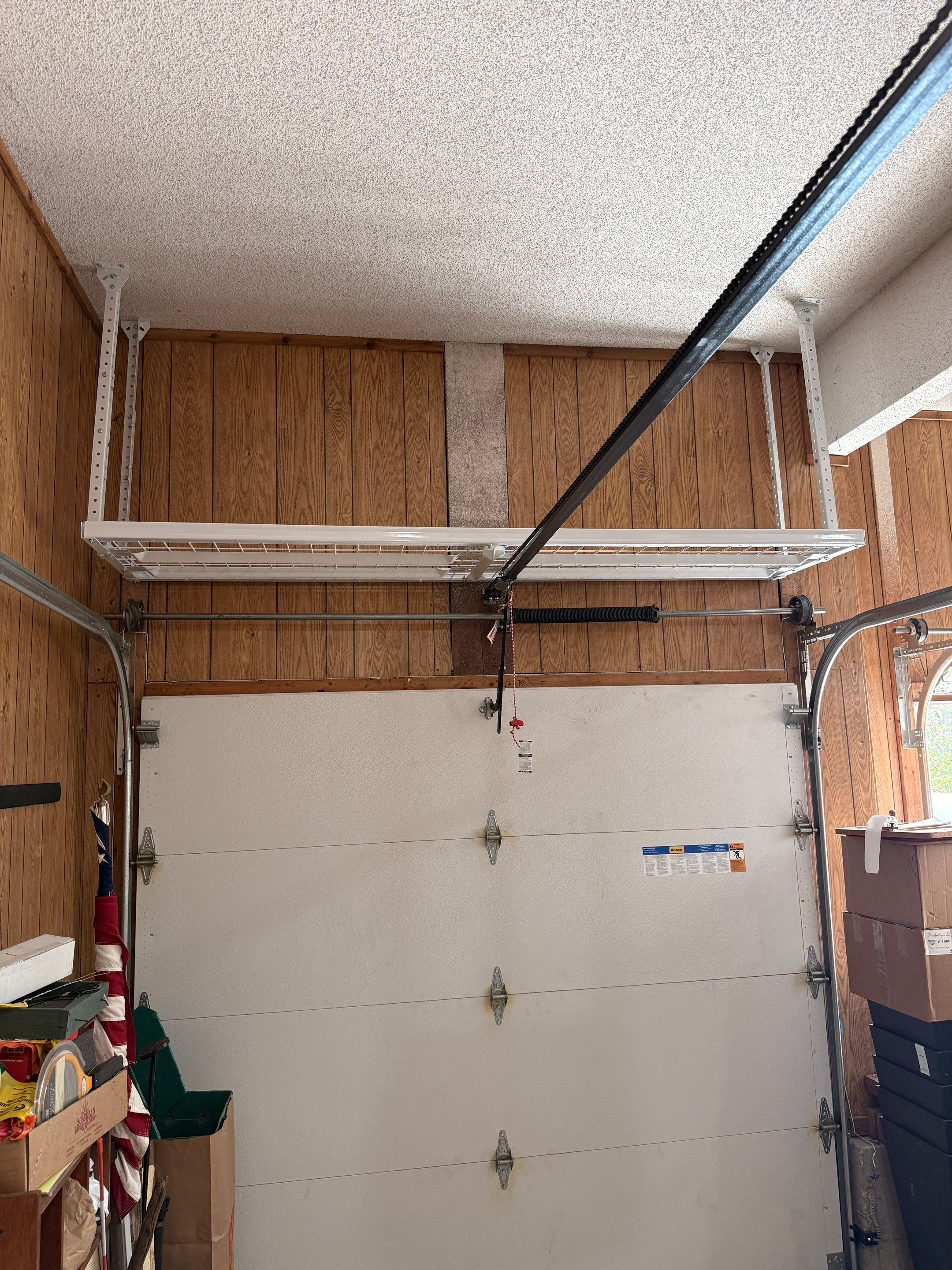 Garage Organization With Overhead Racks and Slatwall in Overland Park by Banner Garage