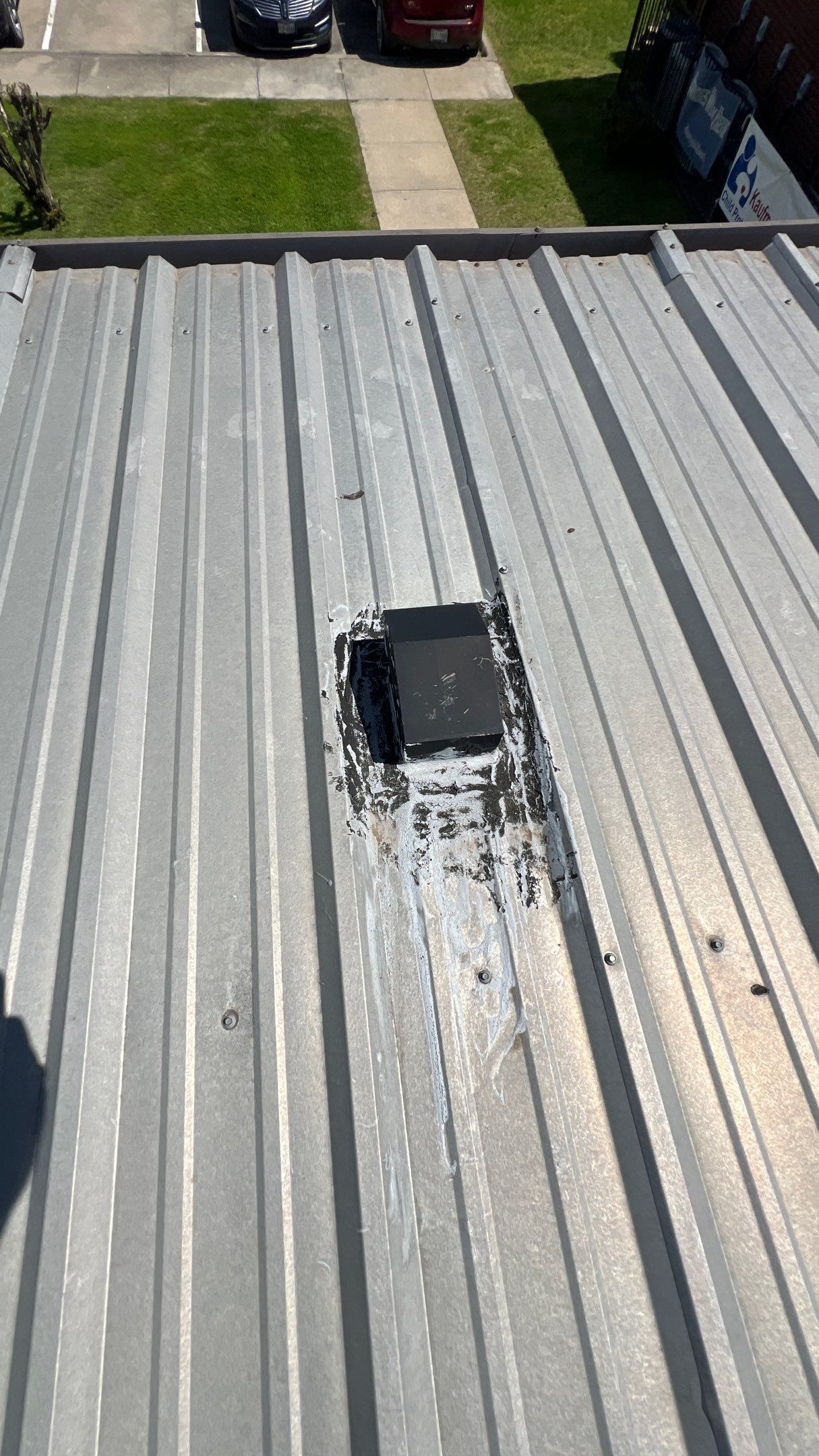 Commercial Roofing Installation using TRP #924 Eterna-Sil Premium Silicone Roof Coating by Harvey Roofing & Construction