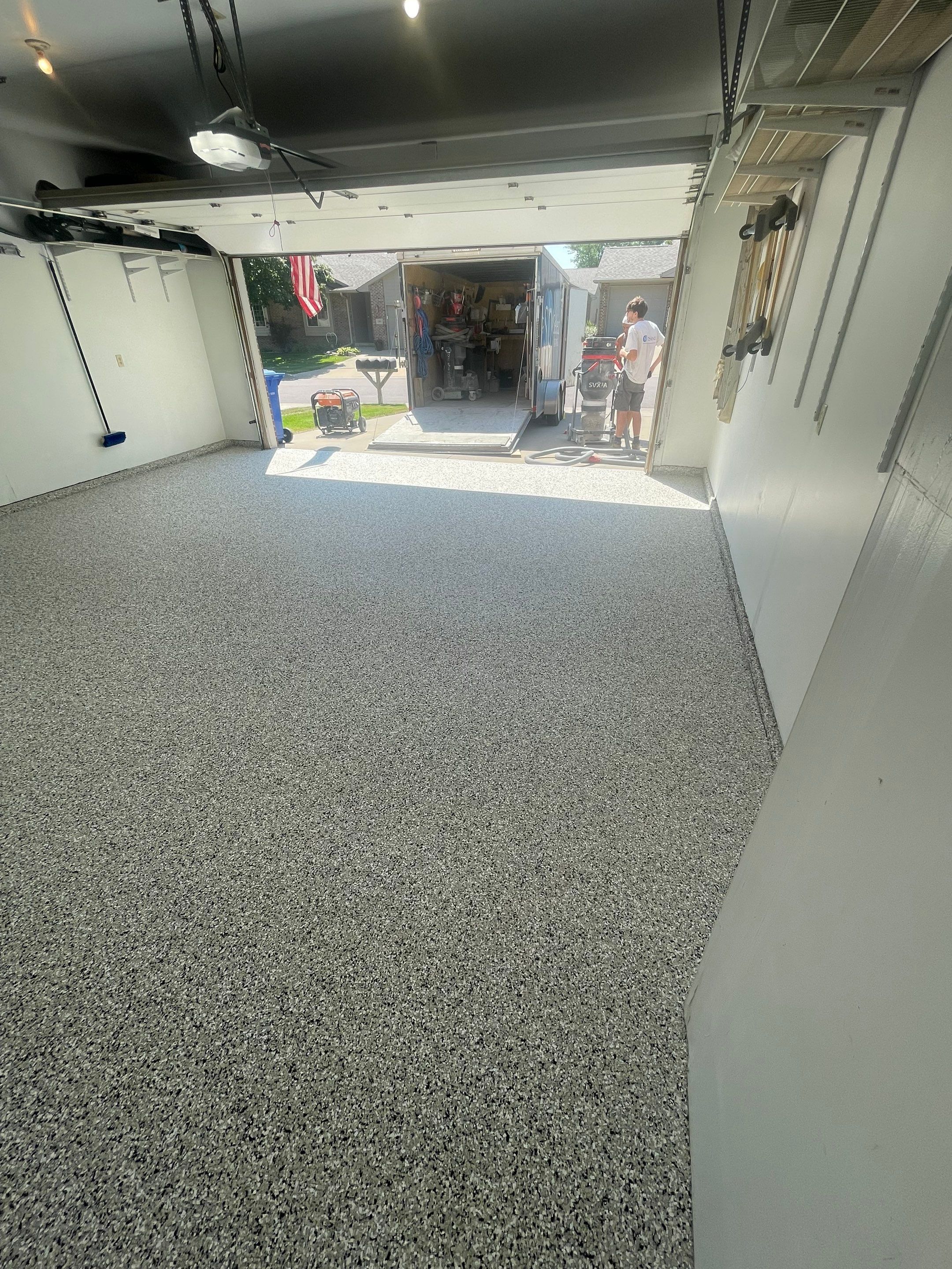 Sioux Falls Residential Garage Floor Coating with Speckled Epoxy Finish by Select Painting, Coatings & Garage Cabinets