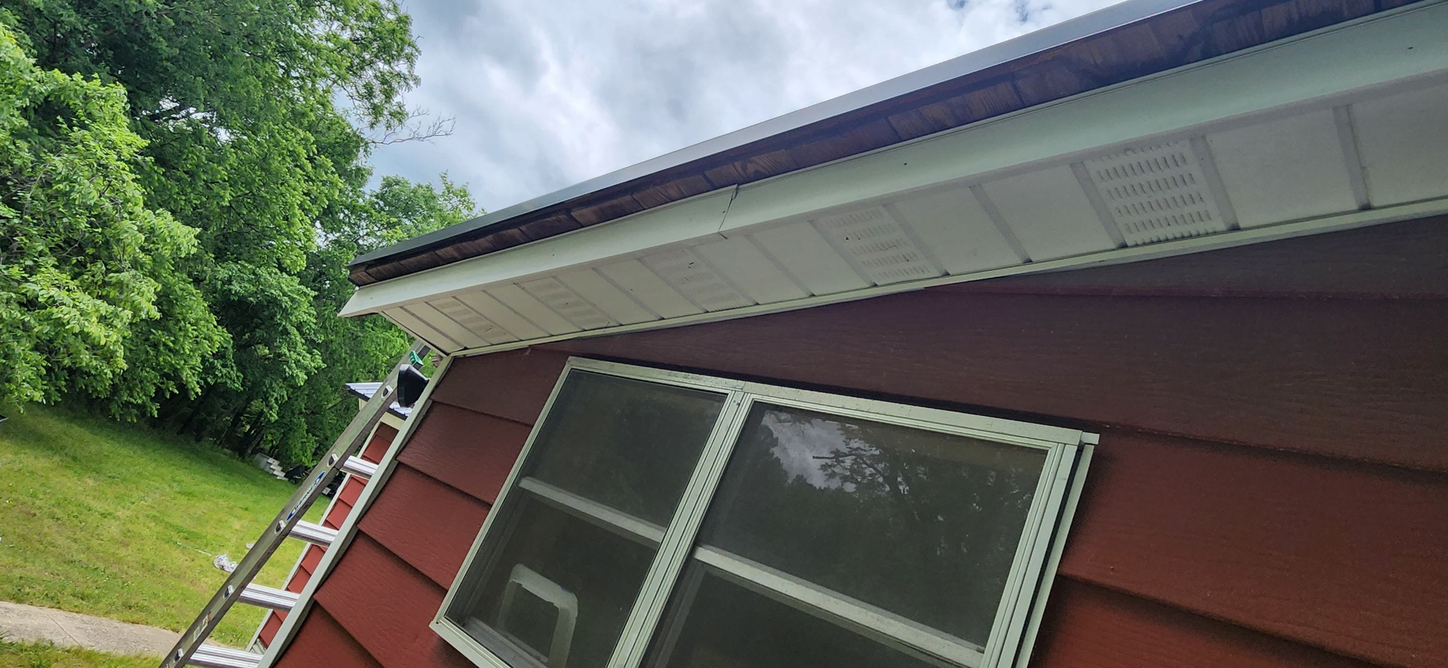 Residential Roofing Installation using 26 Gauge Colored Panels by Hostetler Roofing