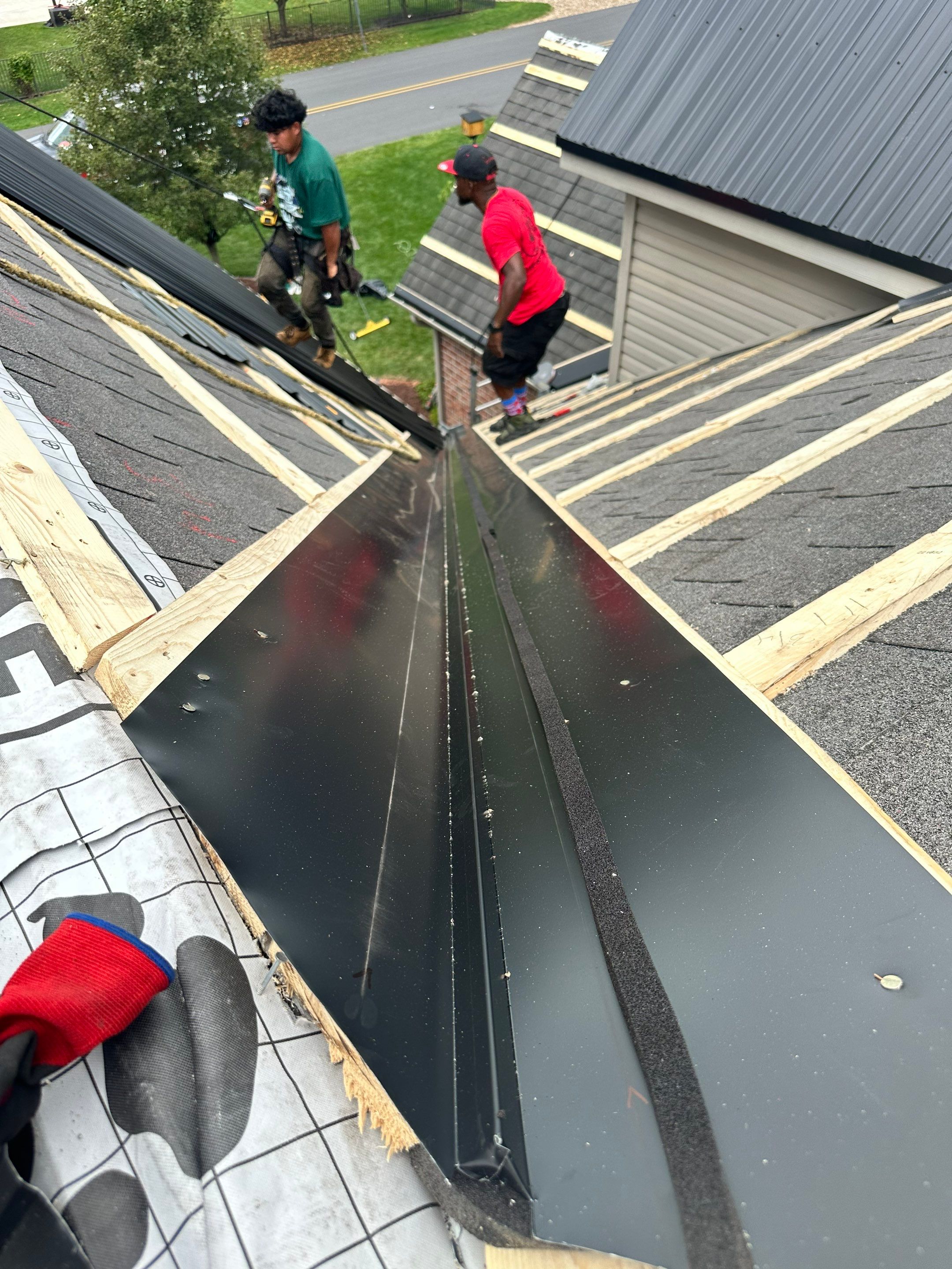 Standing seam / Azm panel in black  by Teflon Roofing