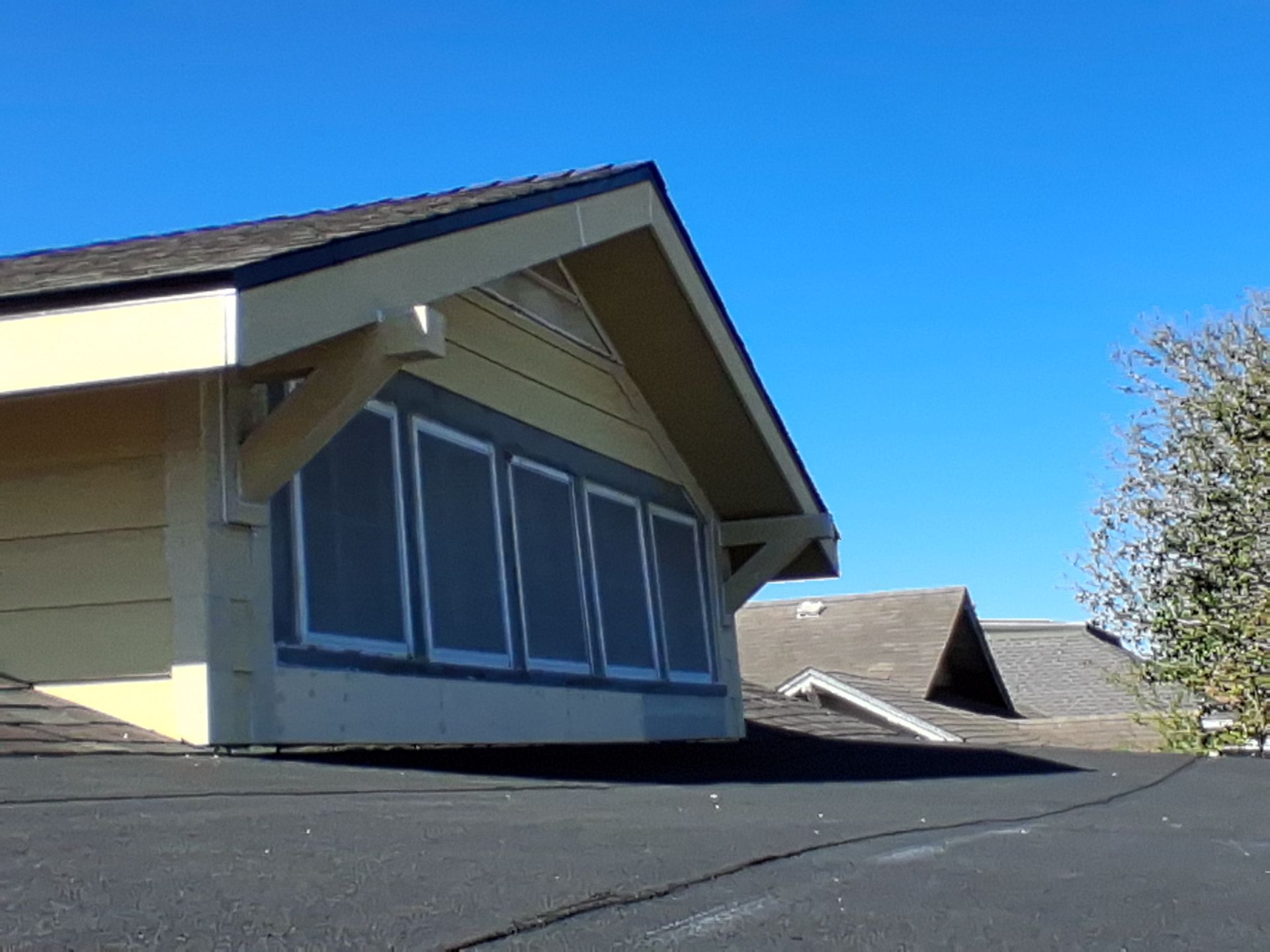 Mid-Century Bungalow by Bayfront Roofing and Construction