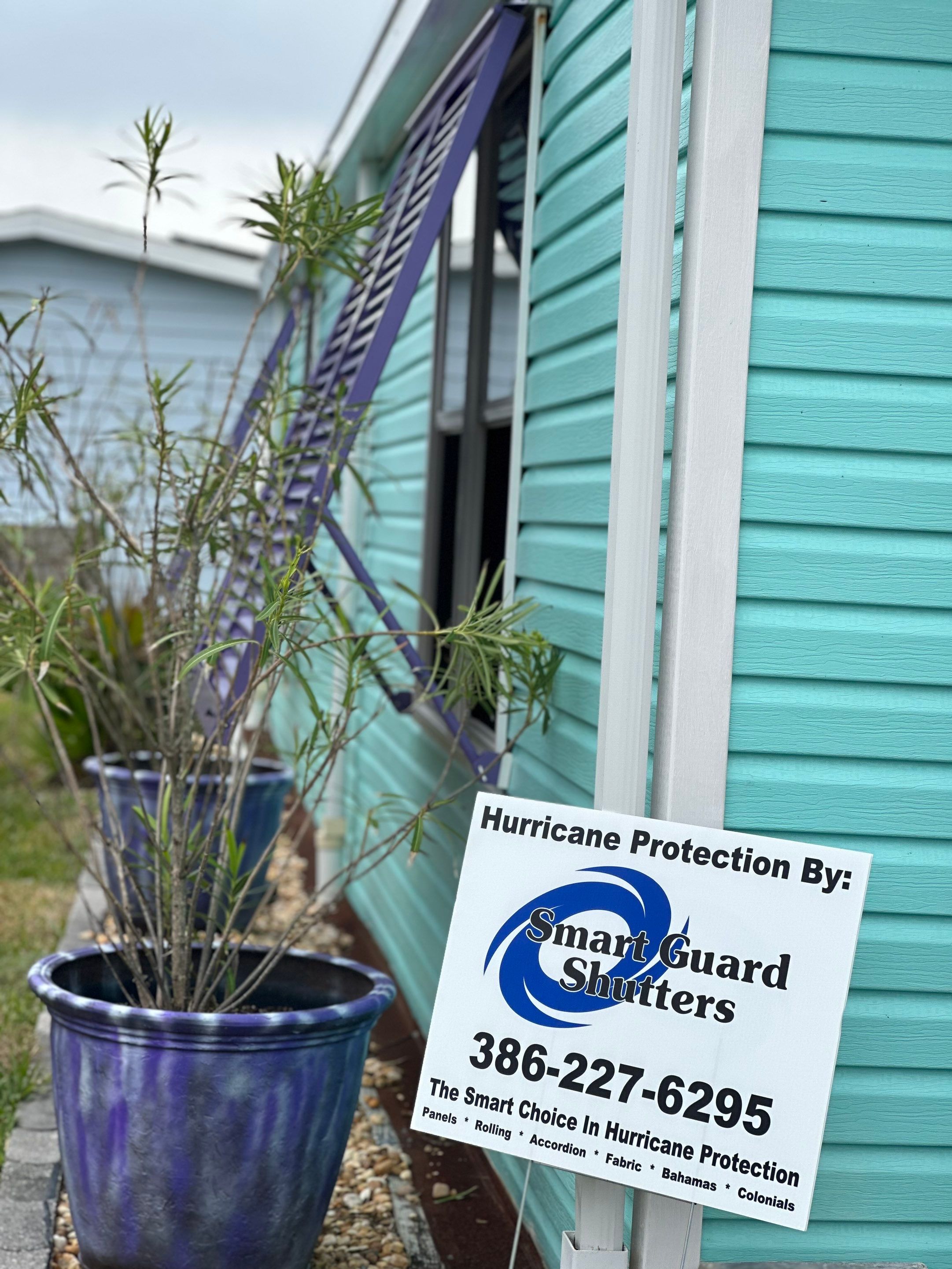 Hurricane Rated Bahama Shutters in Pearl Violet by Smart Guard Shutters