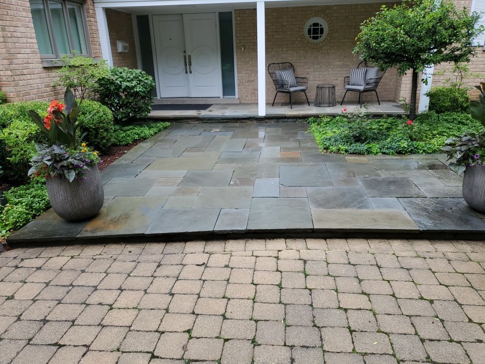 Bluestone patio cleaning by Northern Power Washing LLC.