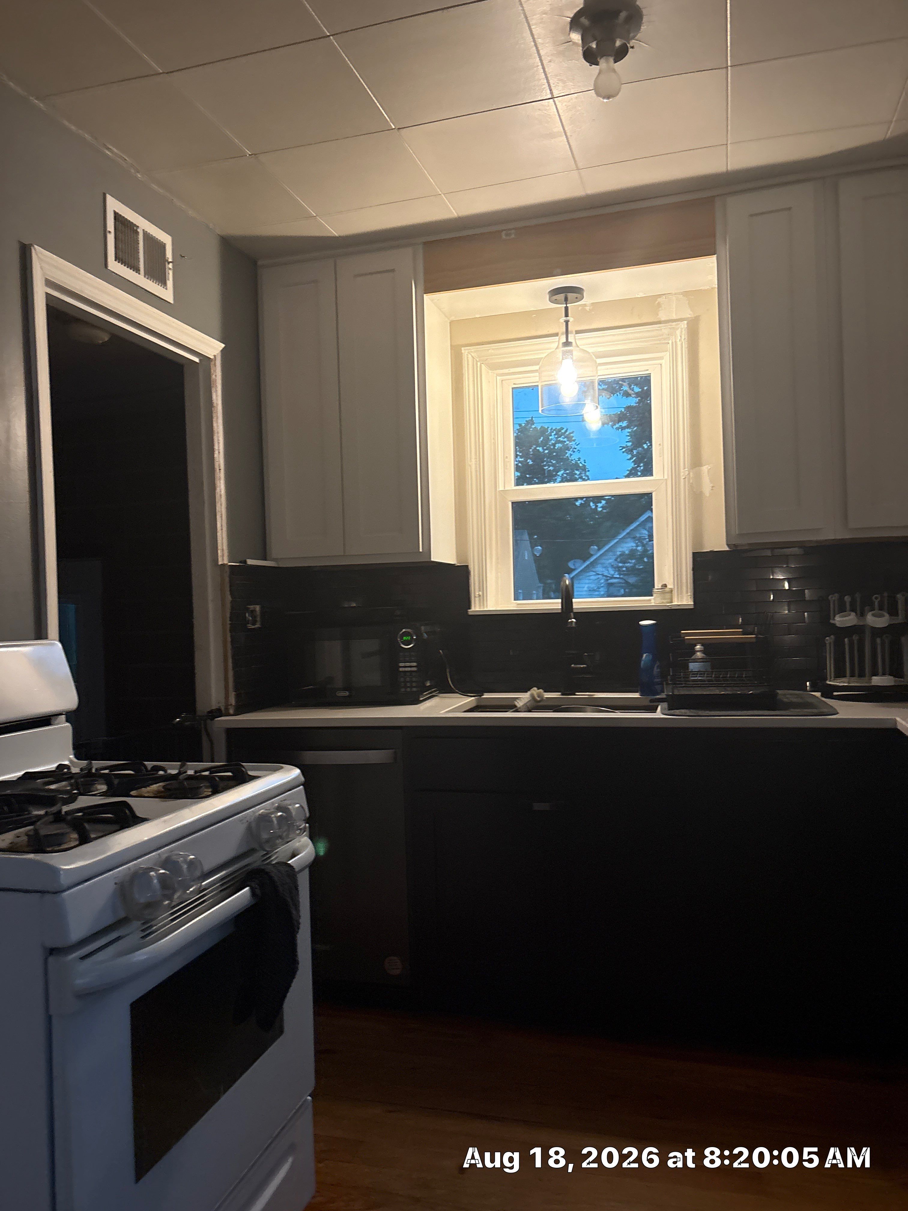 Lincoln Kitchen Renovation Featuring Black and White Shaker Cabinetry by CompanyCam Sales Demo