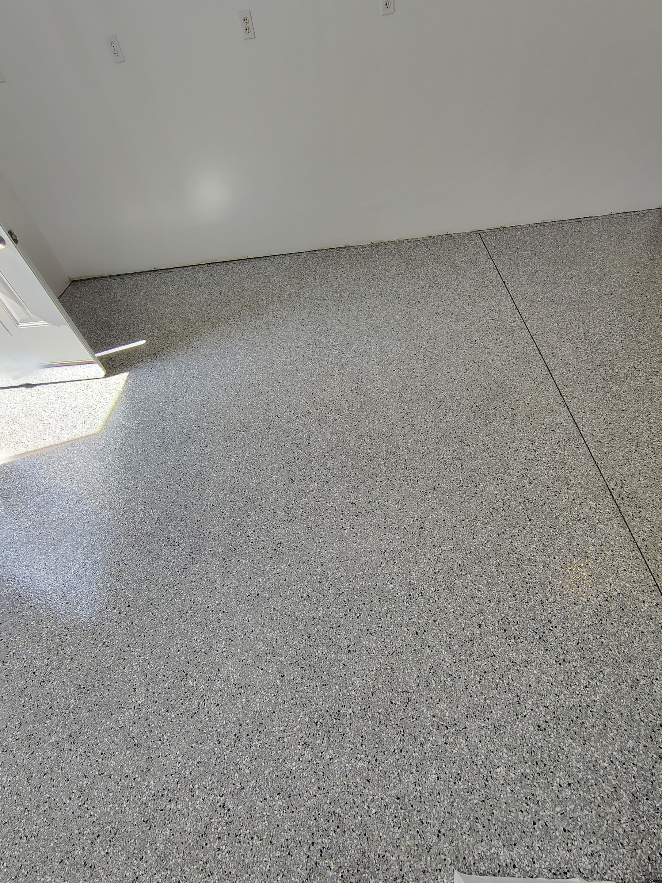 Decorative Chip Concrete Coating Installation in Luverne by Select Painting, Coatings & Garage Cabinets