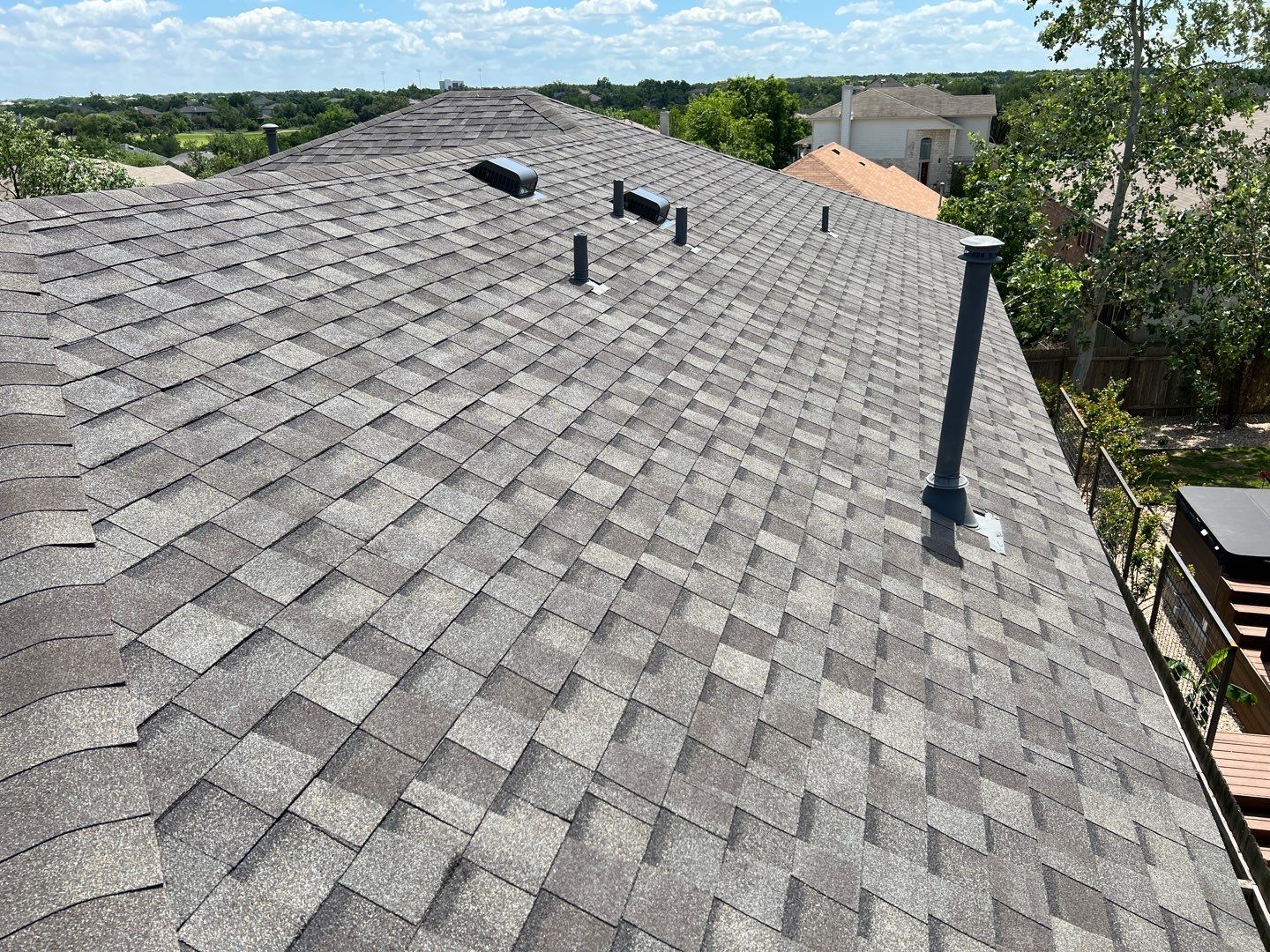 Wind damaged roof replacement by Oakwood Roofing and Construction, LLC