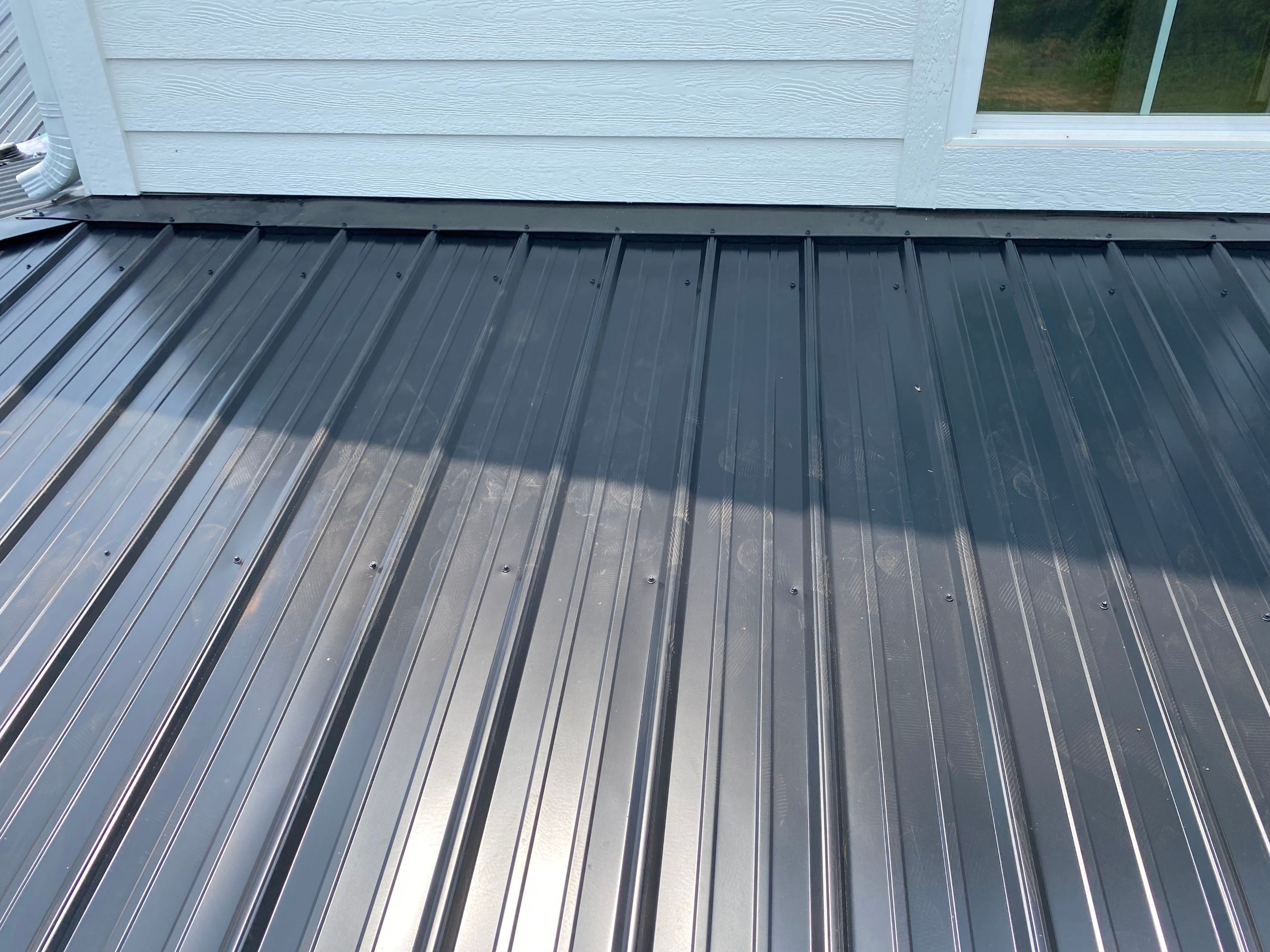 Jason's metal porch roof by BROCK BUILDERS 