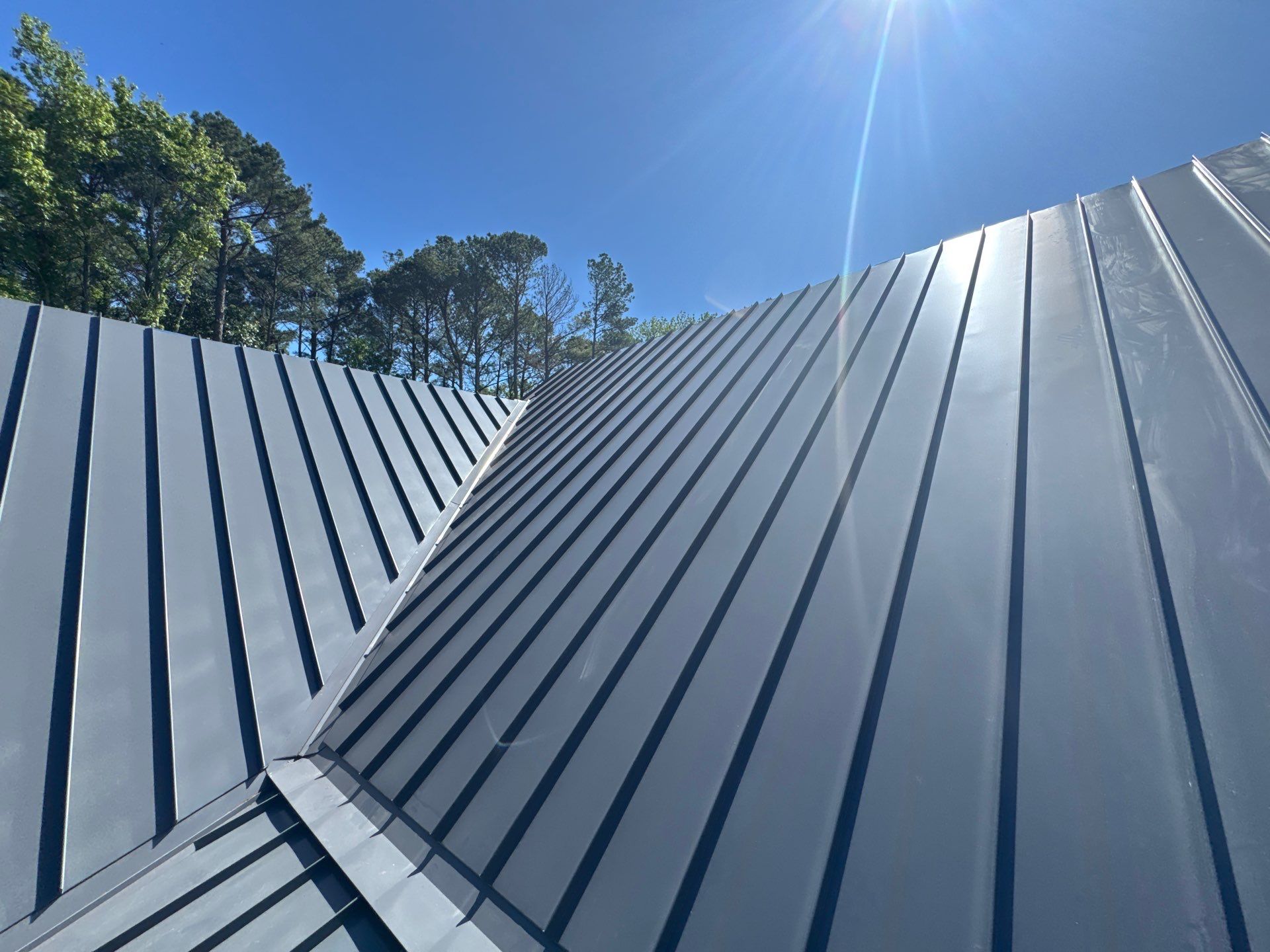 Custom New Construction Home Featuring Standing Seam Metal Roofing in Port Haywood by Cade Construction
