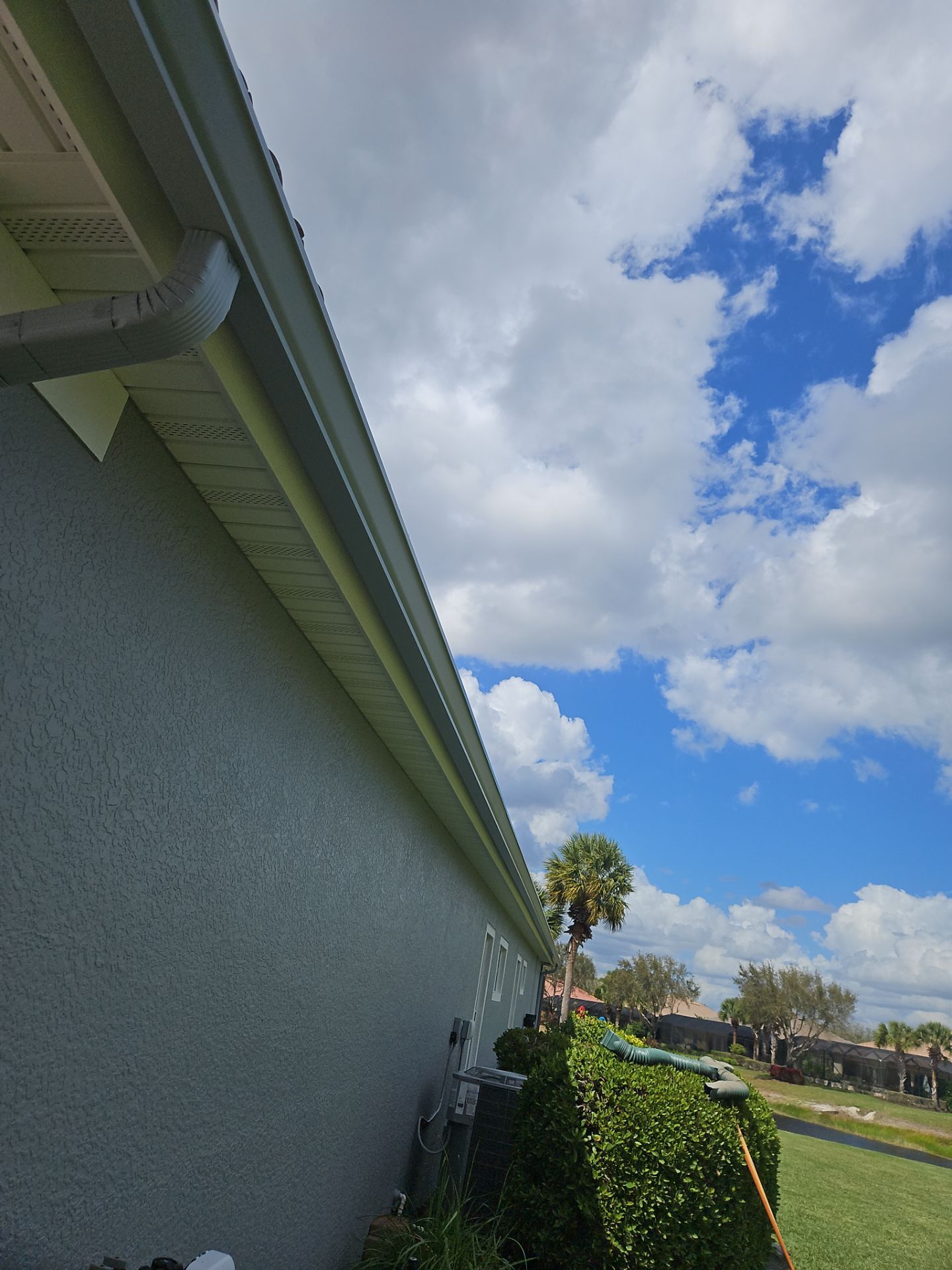 6-inch K-style Seamless Gutters and Splash Guard in Grey Color in Naples FL by Gutter Professors
